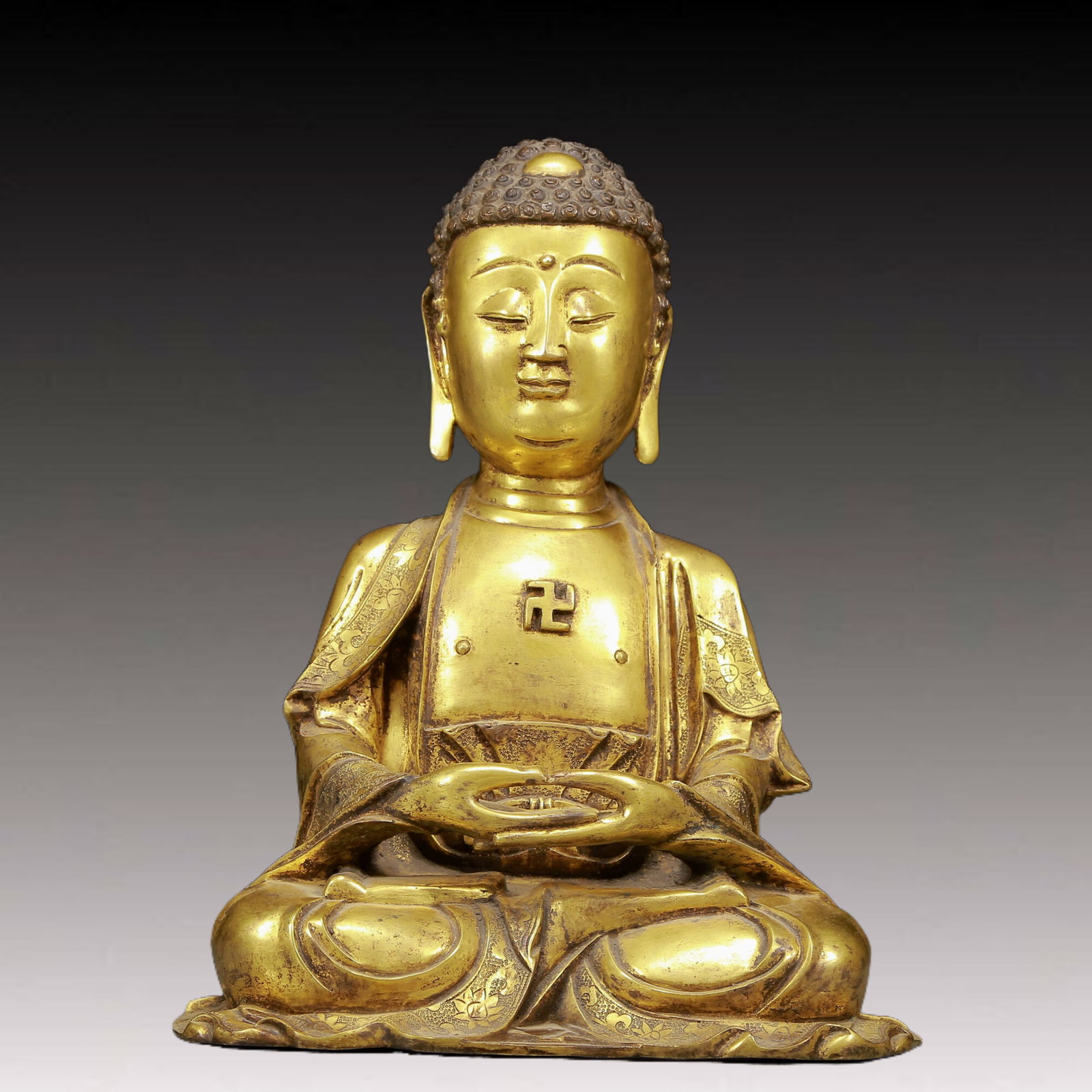 A Solemn Gilt Bronze Statue of Sakyamuni: A Solemn Gilt Bronze Statue of Sakyamuni,Ming Dynasty, China,Xuande Six-character Mark,Size:9.8inx6.3inx12.6in,Weight:6990g 铜鎏金释迦摩尼像，