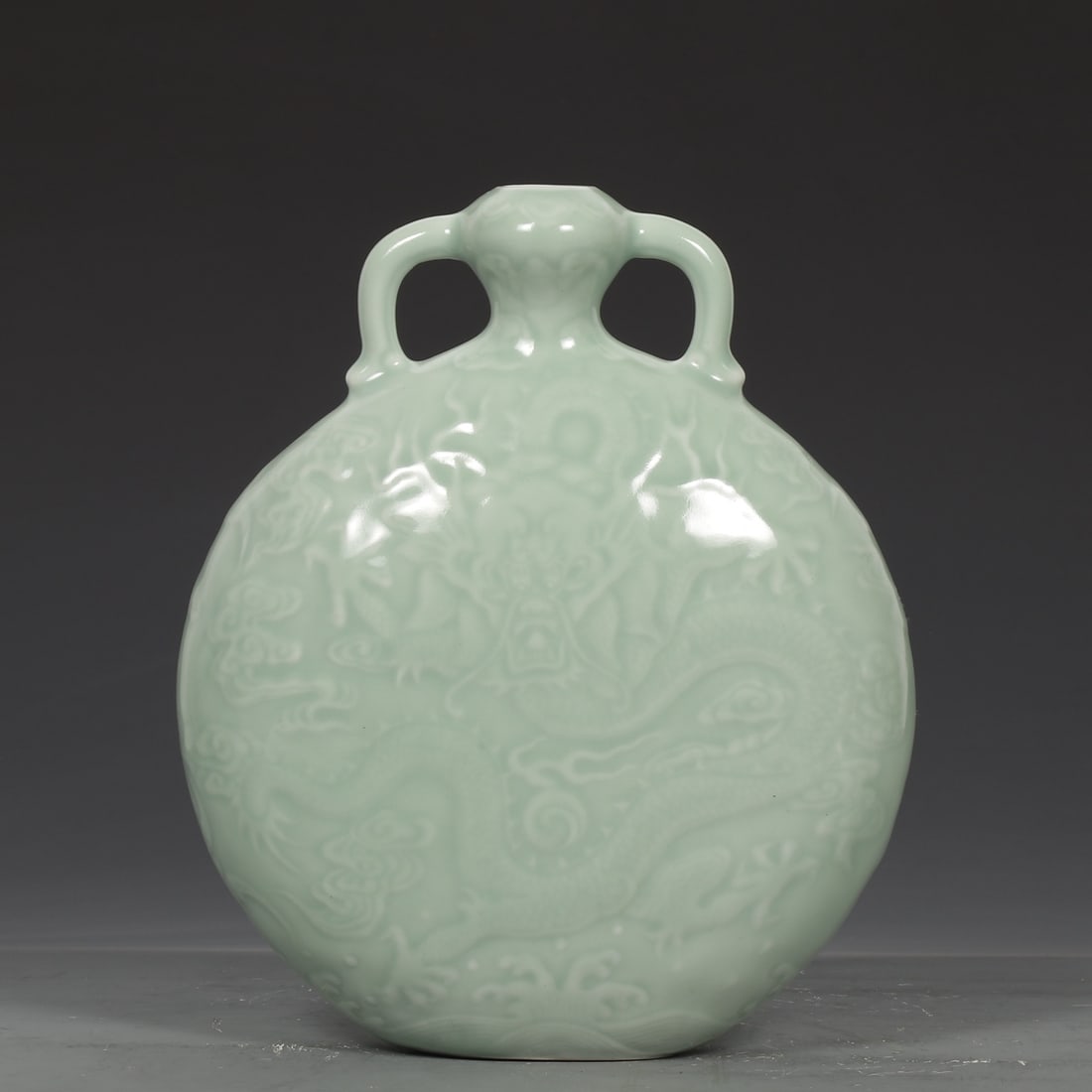 An Exquisite Celadon Glazed Auspicious Cloud and Dragon Pattern Double-Ears Vase (1 of 9)