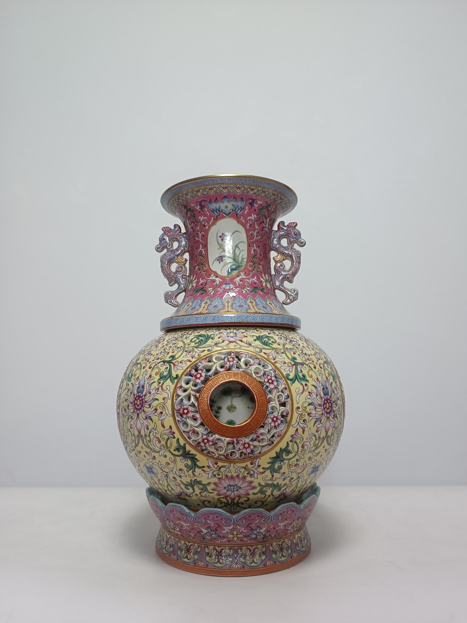 An Exquisite Famille-Rose Yellow Ground Lotus Pattern Double-Ears Vase: An Exquisite Famille-Rose Yellow Ground Lotus Pattern Double-Ears Vase,Qing Dynasty,China,Qianlong Six-character Mark,Size:16.1inx10.4in 粉彩黄地缠枝莲纹