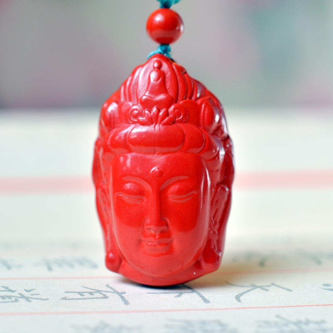 An Exquisite Cinnabar Buddha-head Pendant: An Exquisite Cinnabar Buddha-head Pendant,Size:20mmx32mm (寓意)吉祥招财喜庆、驱邪避凶、安神明İ