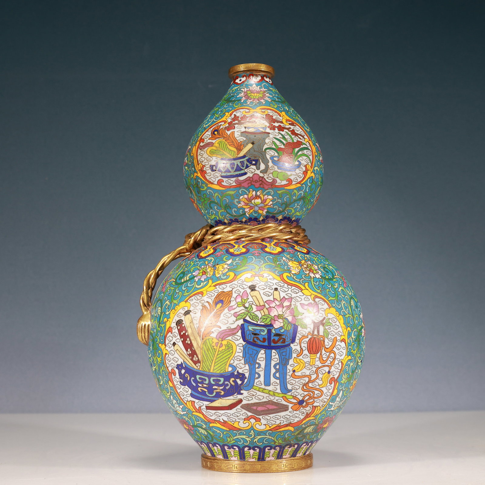 A Rare Cloisonne Lotus and Bogu Pattern Gourd-Shaped Vase: A Rare Cloisonne Lotus and Bogu Pattern Gourd-Shaped Vase,Qing Dynasty, China,Qianlong Four-character Mark,Size:6.7inx14.6in,Weight:5250g 