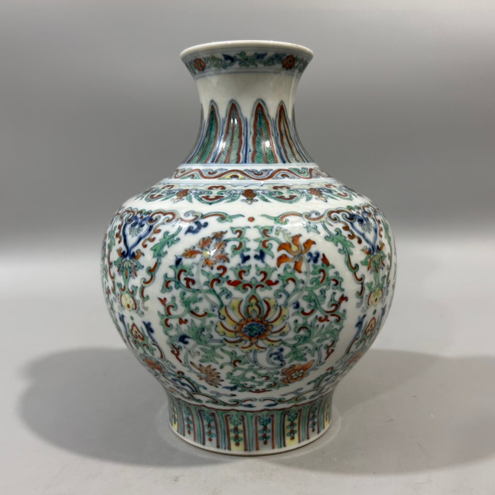 An Exquisite Doucai Lotus Pattern Vase: An Exquisite Doucai Lotus Pattern Vase,Qing Dynasty,China,Qianlong Six-character Mark,Size:5.3inx8.1in 斗彩缠枝莲纹瓶,中国清代,乾