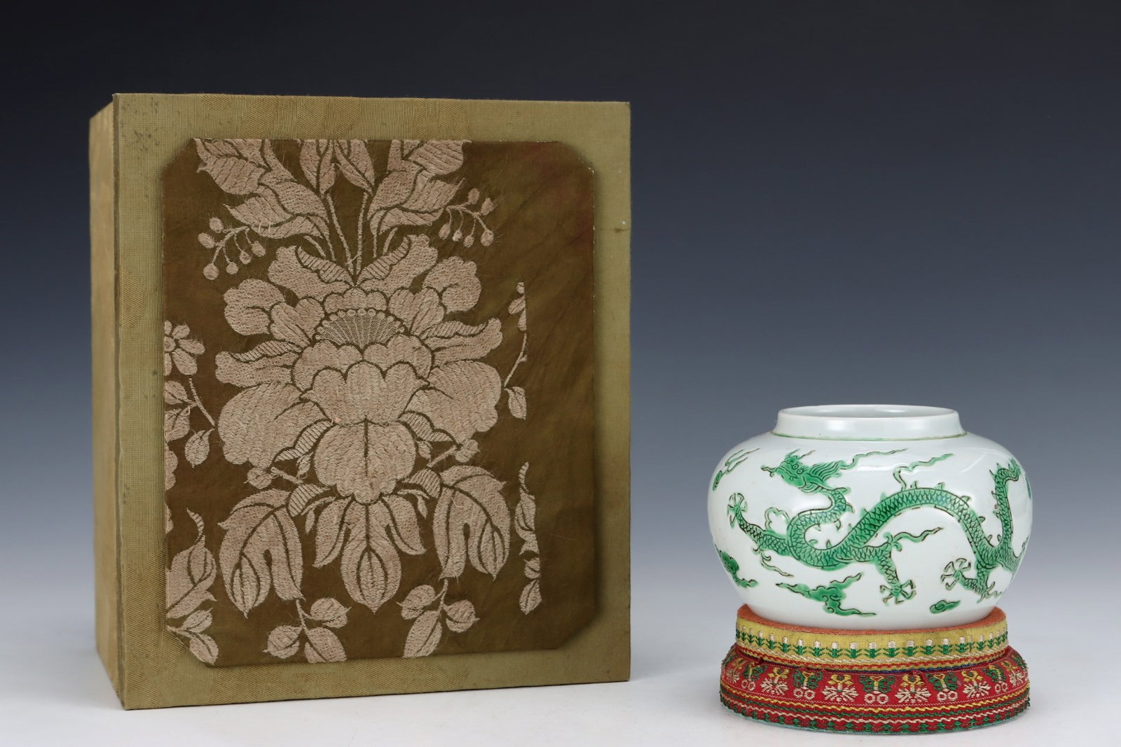 An Exquisite White Glazed Green Color Auspicious Cloud and Dragon Pattern Jar (1 of 8)