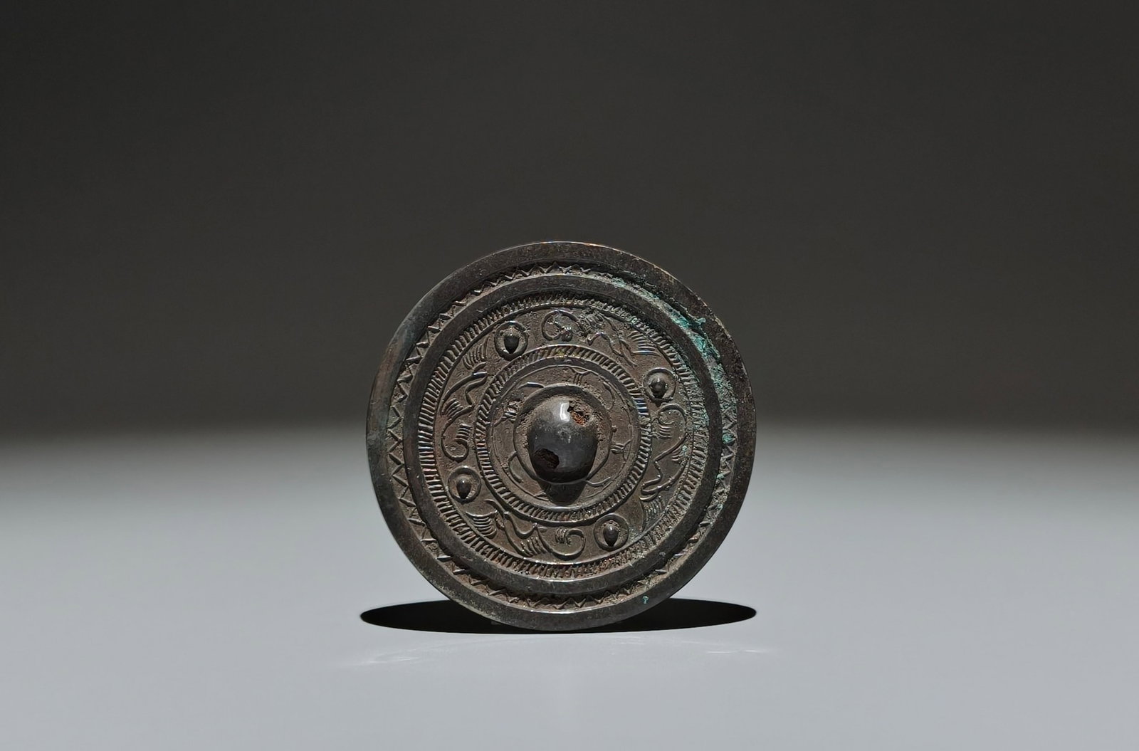An Archaic Bronze Phoenix Pattern Mirror: An Archaic Bronze Phoenix Pattern Mirror,Han Dynasty,China,Size:3.3in 青铜凤纹镜子,中国汉代