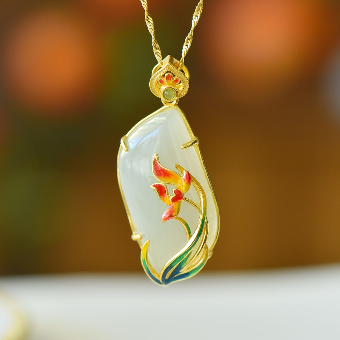 An Exquisite Sterling Silver-Gold Plated Inlaid White Jade Pendant: An Exquisite Sterling Silver-Gold Plated Inlaid White Jade Pendant,Size:17mmx34mm 纯银镀金镶白玉吊坠