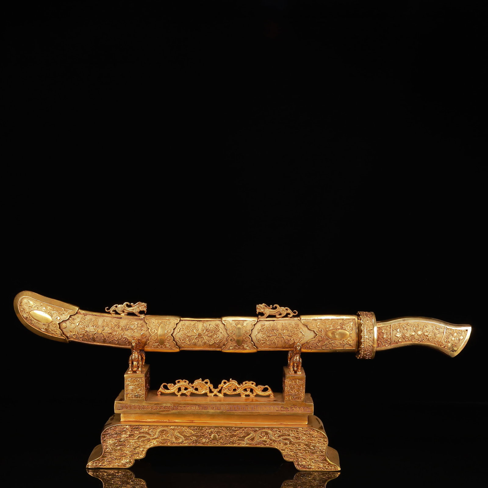 A Huge Gilt Bronze Sword Ornament: A Huge Gilt Bronze Sword Ornament,Qing Dynasty, China,Size:28.7inx2.8inx11in,Weight:5100g 铜鎏金刀摆件,中国清代