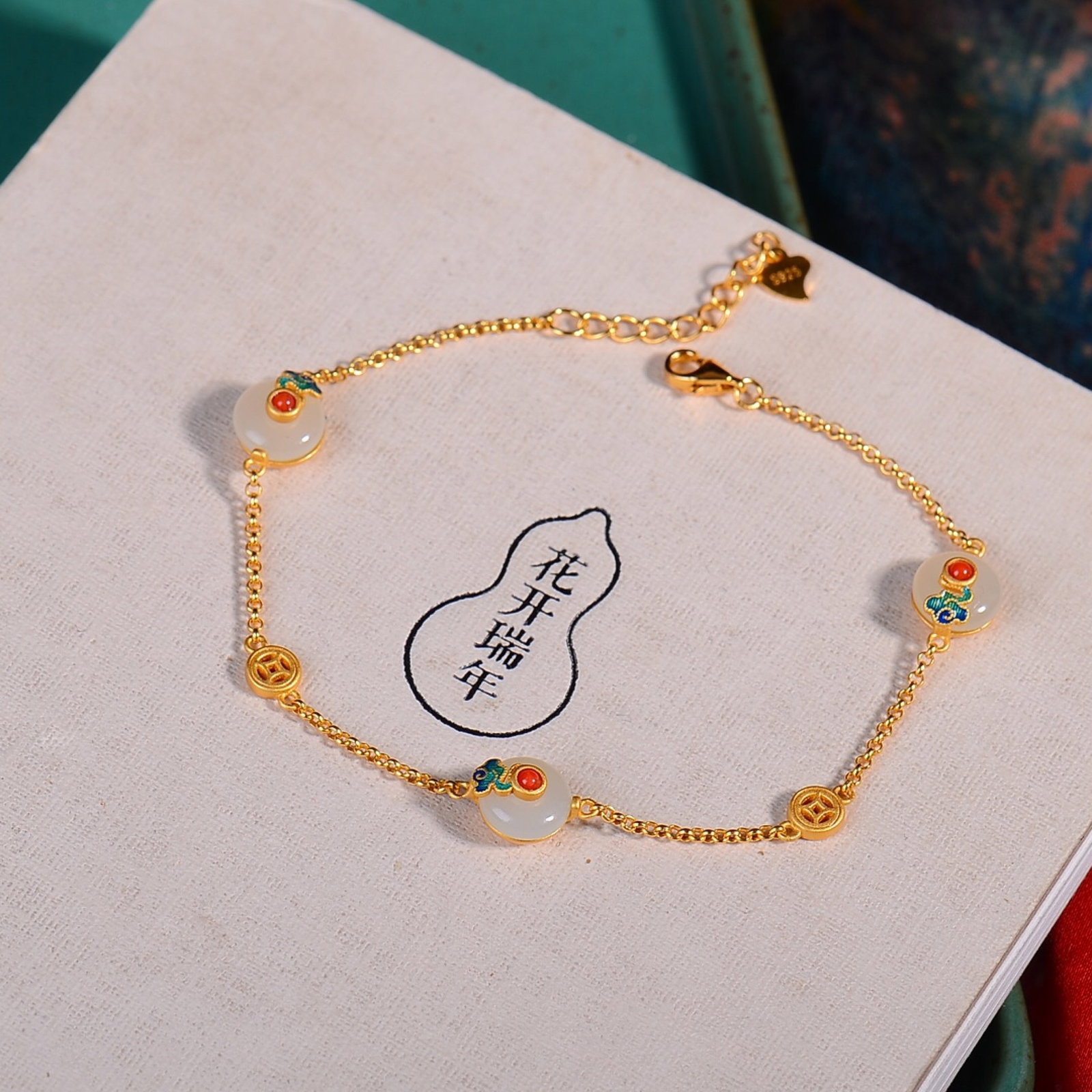 An Exquisite Sterling Silver-Gold Plated Inlaid White Jade Enamel Bracelets: An Exquisite Sterling Silver-Gold Plated Inlaid White Jade Enamel Bracelets,Size:8mmx8mm 纯银镀金镶白玉珐琅手链