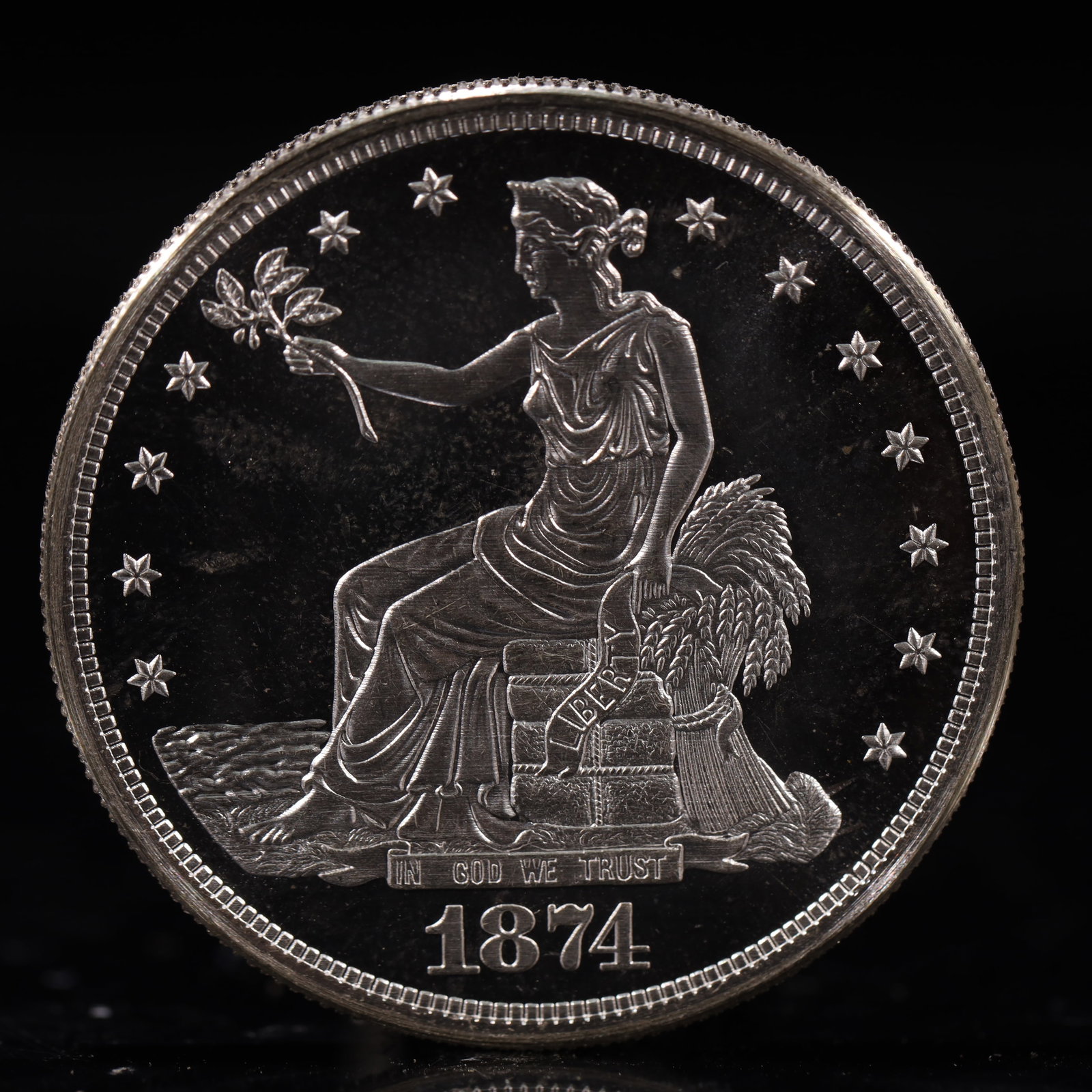 USA Trade Dollar 1874 Coin: American coin. Obverse: Liberty seated on a pedestal facing the sea to the left holding olive branches surrounded by 13 stars. IN GOD WE TRUST / LIBERTY / 1874. Reverse: An eagle holding branches with