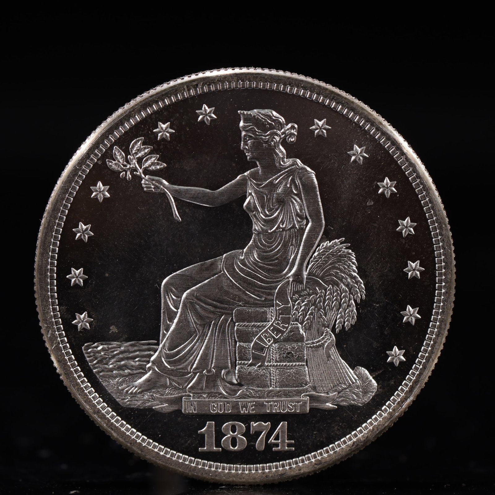 USA Trade Dollar 1874 Coin: American coin. Obverse: Liberty seated on a pedestal facing the sea to the left holding olive branches surrounded by 13 stars. IN GOD WE TRUST / LIBERTY / 1874. Reverse: An eagle holding branches with