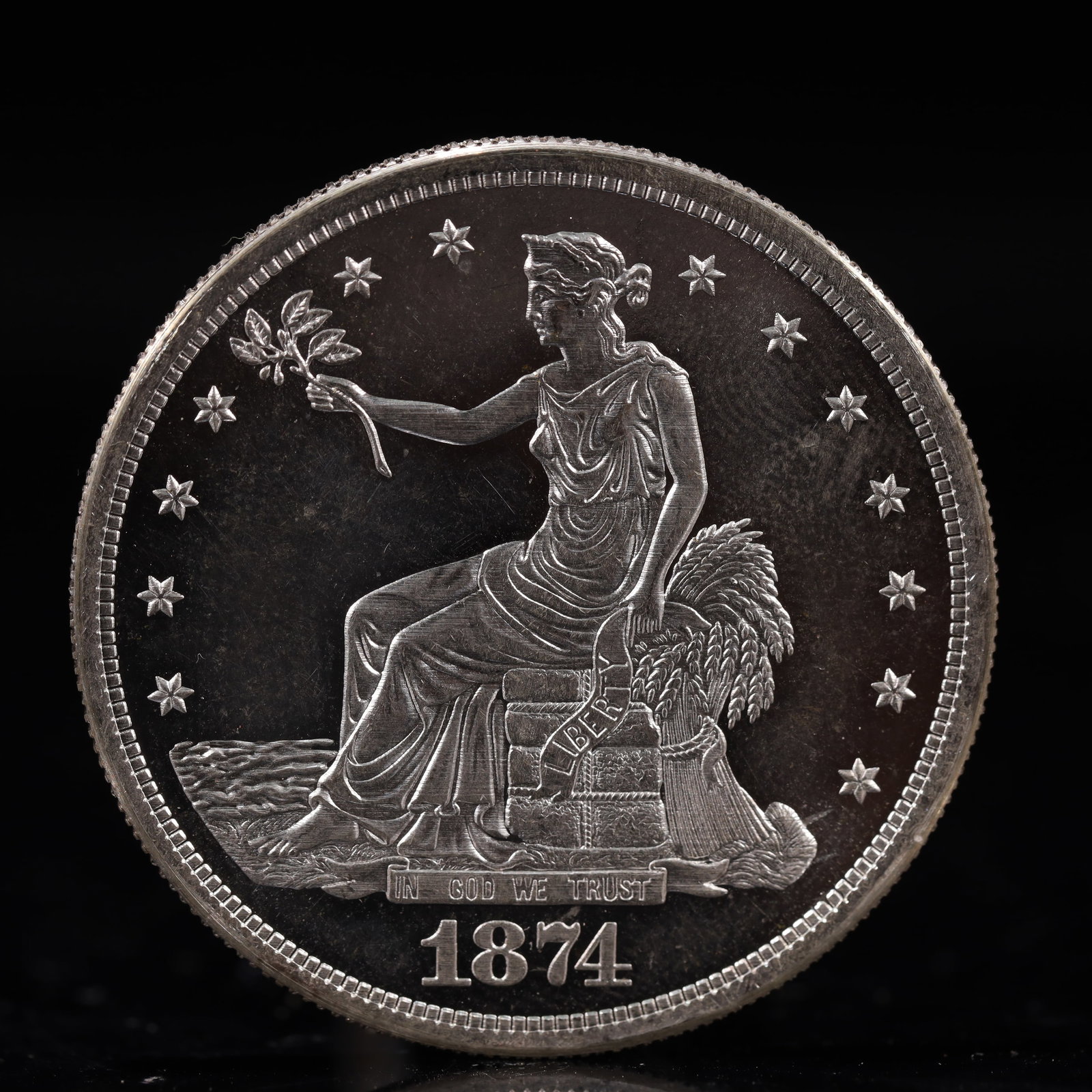 USA Trade Dollar 1874 Coin: American coin. Obverse: Liberty seated on a pedestal facing the sea to the left holding olive branches surrounded by 13 stars. IN GOD WE TRUST / LIBERTY / 1874. Reverse: An eagle holding branches with