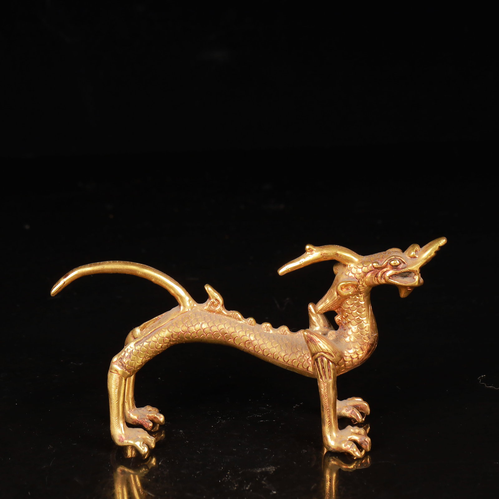 An Exquisite Gilt Bronze Dragon Ornament: An Exquisite Gilt Bronze Dragon Ornament,Qing Dynasty,China,Size:6.3inx2inx3.5in,Weight:334g 铜鎏金龙摆件,中国清代
