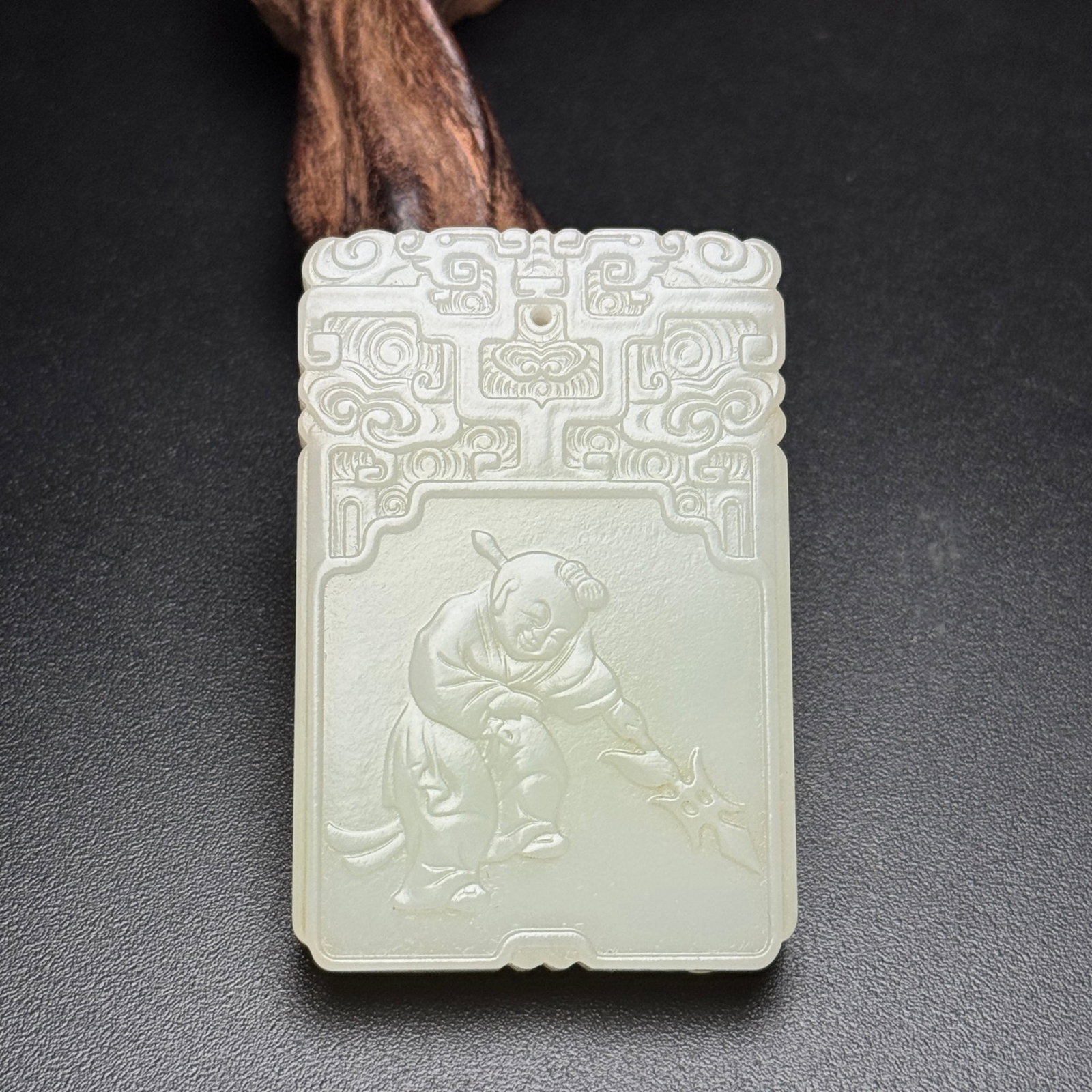 An Exquisite White Jade Figure Pattern Pendant: An Exquisite White Jade Figure Pattern Pendant,Qing Dynasty,China,Size:60mmx39mmx8mm,Weight:51g 白玉人物纹挂件,中国清代