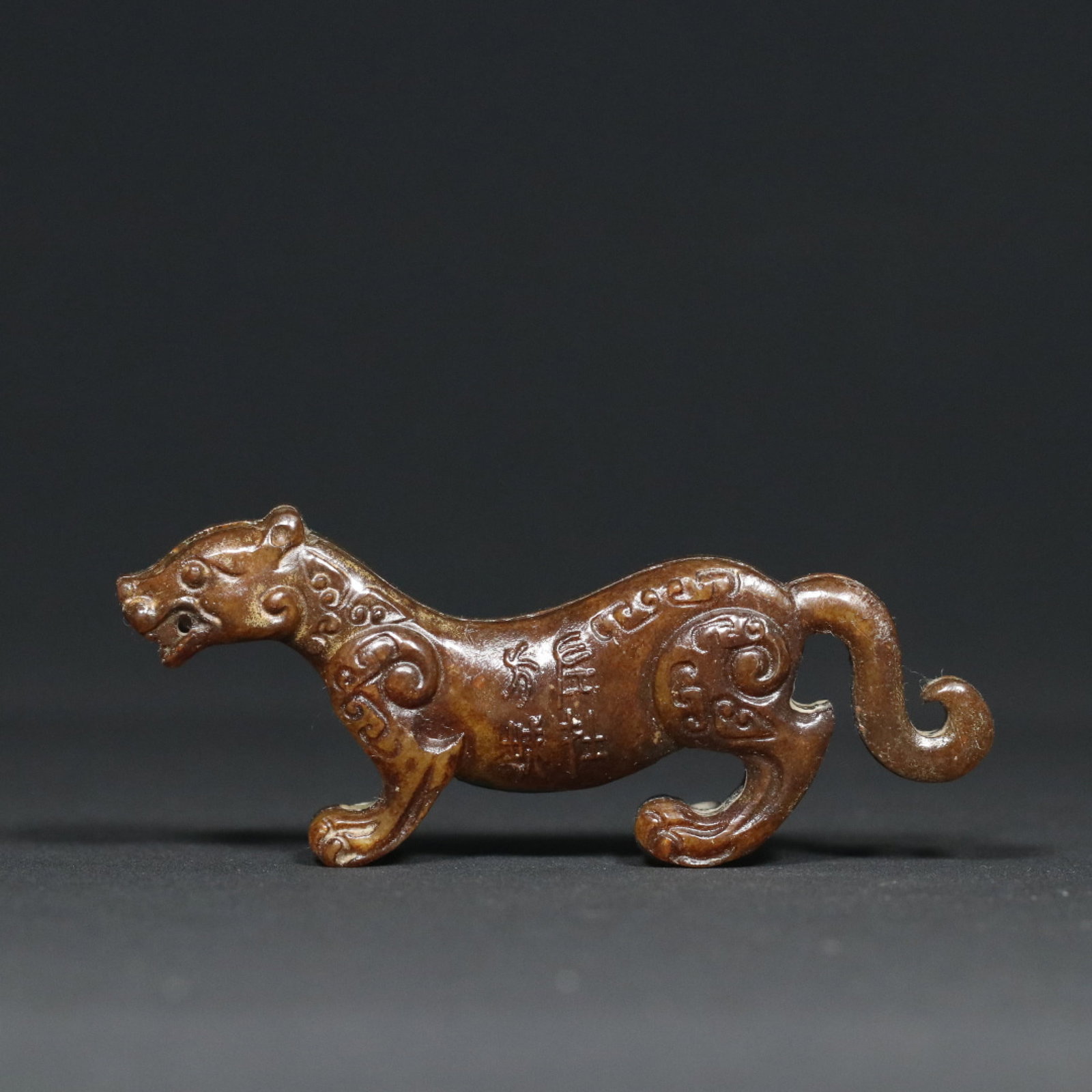 An Exquisite Archaic Jade Tiger Tally: An Exquisite Archaic Jade Tiger Tally,Ancient Time,China,Size:4inx1.7inx0.6in,Weight:63.5g 高古玉虎符,中国远古时期