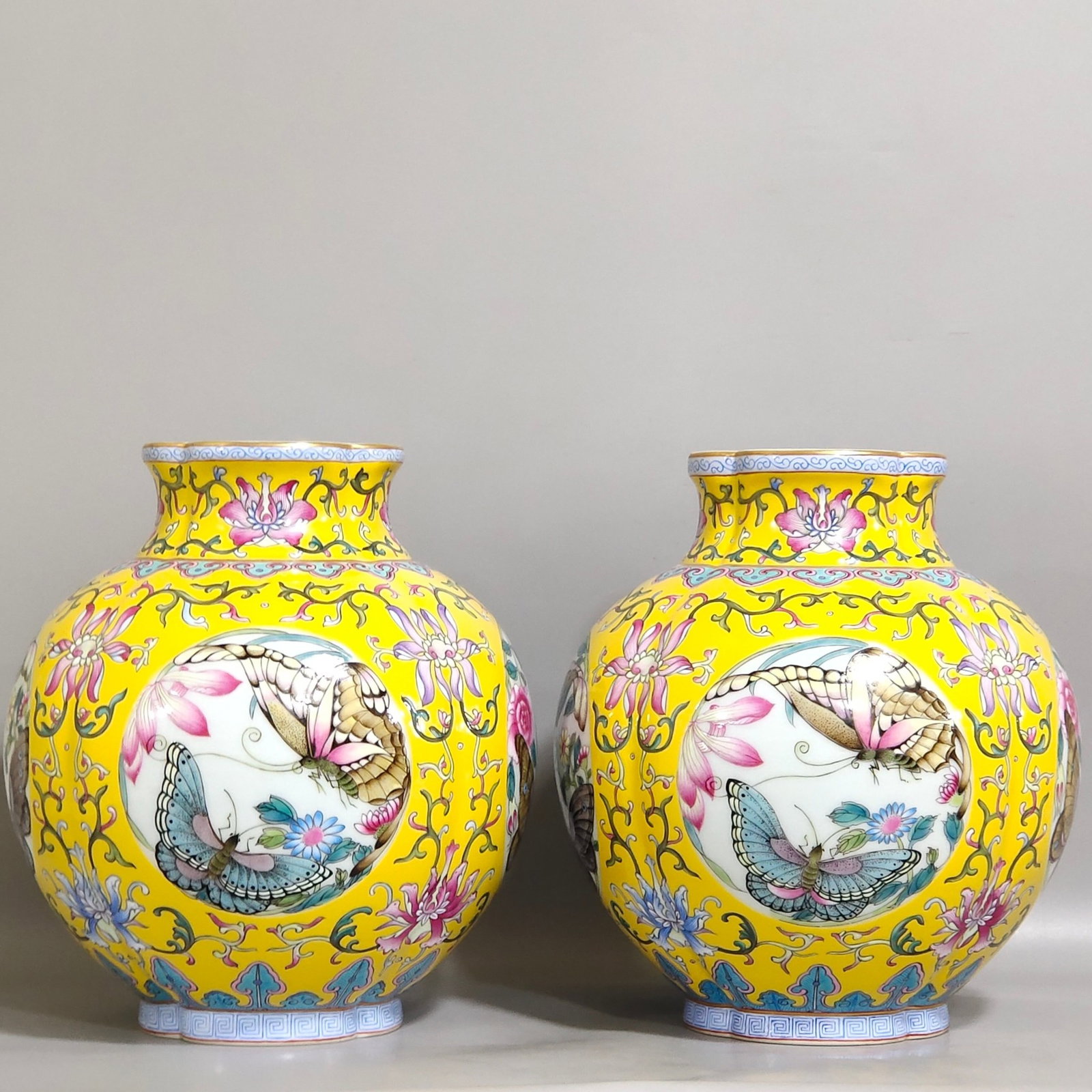 A Pair of Exquisite Yellow Ground Famille-Rose Painted Gold Flower and Butterfly Pattern Jars: A Pair of Exquisite Yellow Ground Famille-Rose Painted Gold Flower and Butterfly Pattern Jars,Qing Dynasty,China,Yongzheng Four-character Mark,Size:7.7inx6.5in 