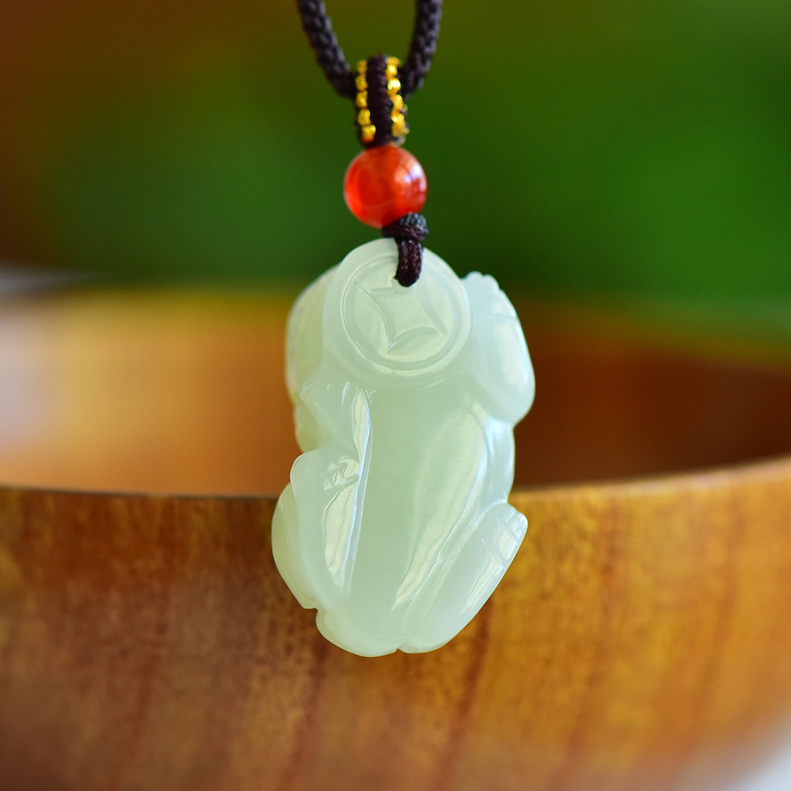 An Exquisite Greenish Jade Auspicious Beast Pendant: An Exquisite Greenish Jade Auspicious Beast Pendant,Size:33mmx18mm 寓意: 天地守护 吉祥如意 辟邪护佑 