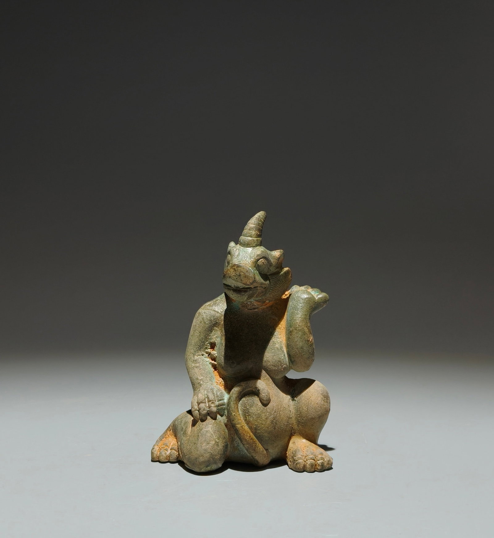 An Archaic Bronze Unicorn Ornament: An Archaic Bronze Unicorn Ornament,the Warring States period in China,Size:4.1inx3inx1.4in 青铜独角兽摆件,中国战国时期