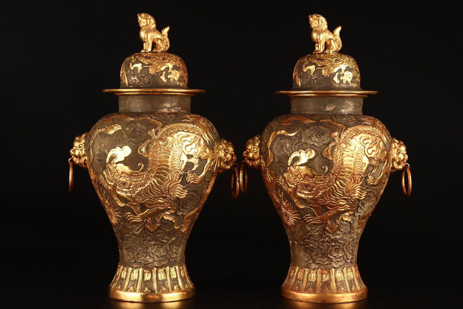 A Pair of Exquisite Gilt Bronze Auspicious Cloud and Lion Pattern Beast-Ears Cover Jars: A Pair of Exquisite Gilt Bronze Auspicious Cloud and Lion Pattern Beast-Ears Cover Jars,Qing Dynasty,China,Qianlong Four-character Mark,Size:11inx5.9in,Total Weight:2978g 一对铜Ź