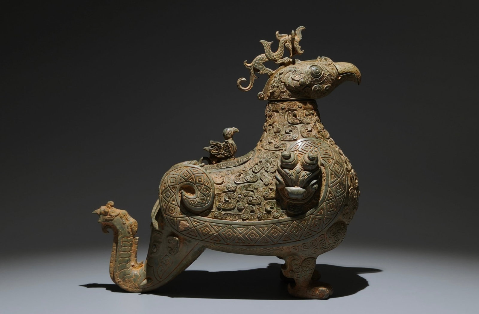 An Archaic Bronze Coiled-Dragon Pattern Bird-Shaped Food Vessel,With Inscription: An Archaic Bronze Coiled-Dragon Pattern Bird-Shaped Food Vessel,With Inscription,the Spring and Autumn in Period in China,Size:11.8inx11.4inx6.3in