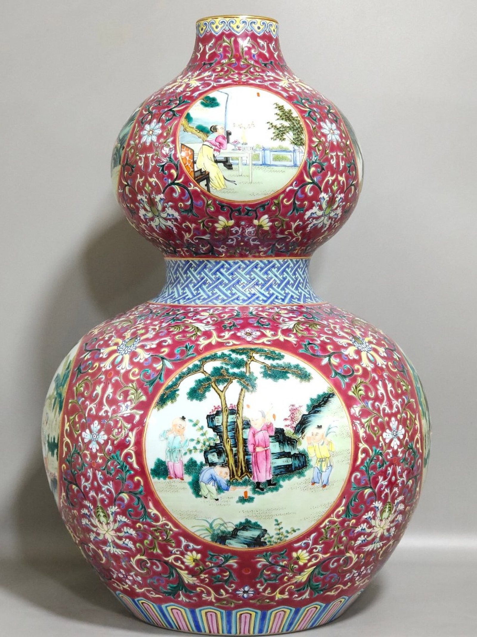 A Huge Ruby Red-Ground Famille-Rose Painted Gold Lotus and Figure Pattern Gourd Vase (1 of 9)