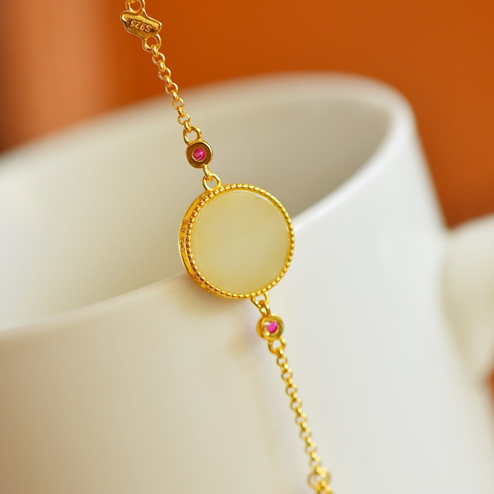 An Exquisite Sterling Silver-Gold Plated Inlaid White Jade Bracelet: An Exquisite Sterling Silver-Gold Plated Inlaid White Jade Bracelet,Size:12mmx12mm 纯银镀金镶白玉手链