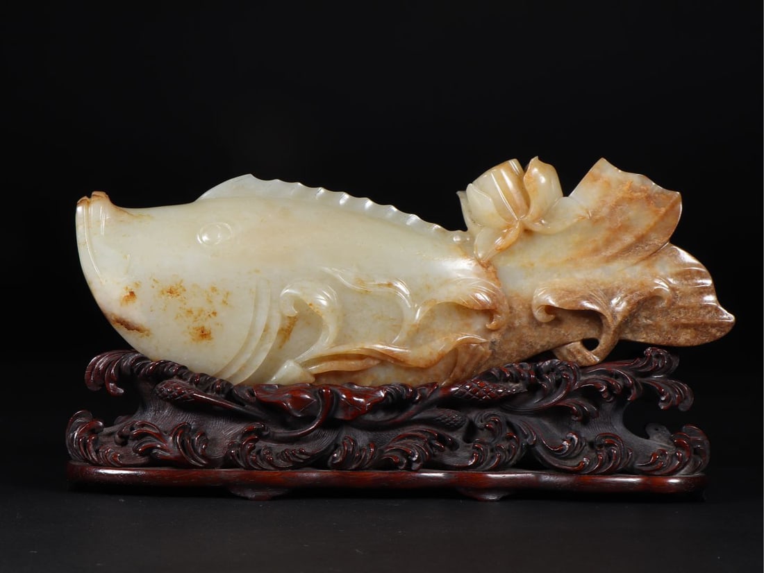 An Exquisite White Jade Fish Ornament ,With Zitanwood Base: An Exquisite White Jade Fish Ornament ,With Zitanwood Base,Qing Dynasty, China,Size:8.8inx1.4inx2.9in,Weight:670g 白玉鱼摆件 ,带紫檀木底