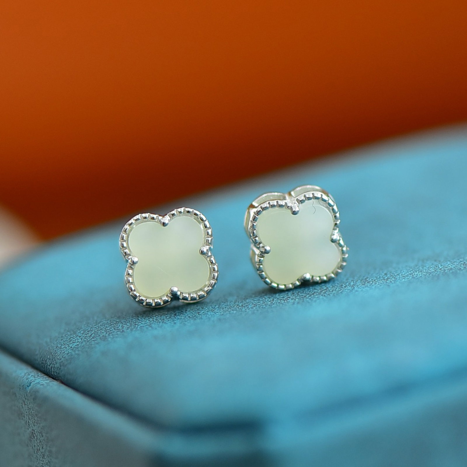 A Pair of Exquisite Sterling Silver Inlaid White Jade Earrings: A Pair of Sterling Silver Inlaid White Jade Earring , Size :8mmx8mms 一对纯银镶白玉耳钉,尺寸:8mmx8mm