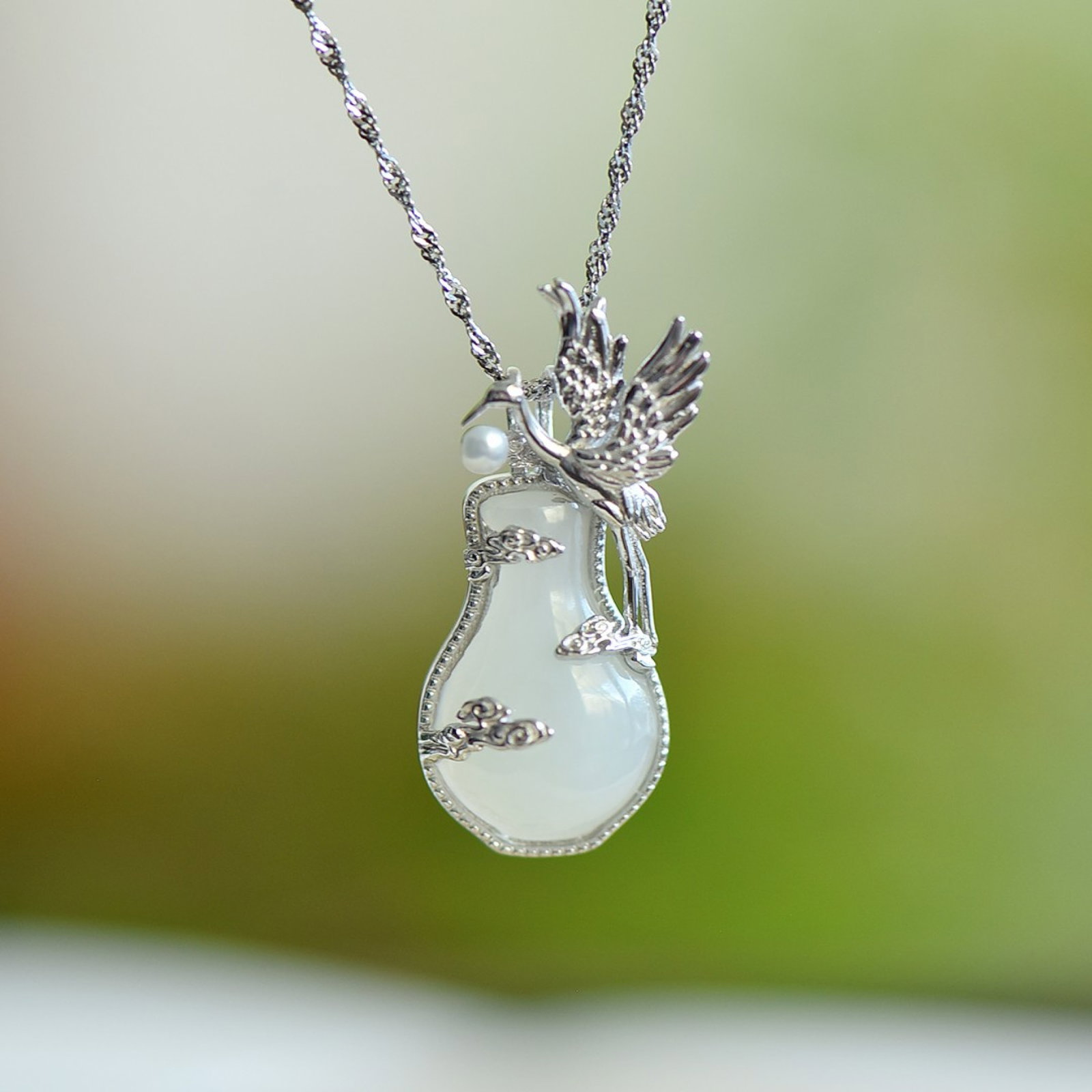 An Exquisite Sterling Silver Inlaid White Jade Pendant: An Exquisite Sterling Silver Inlaid White Jade Pendant 纯银镶白玉吊坠