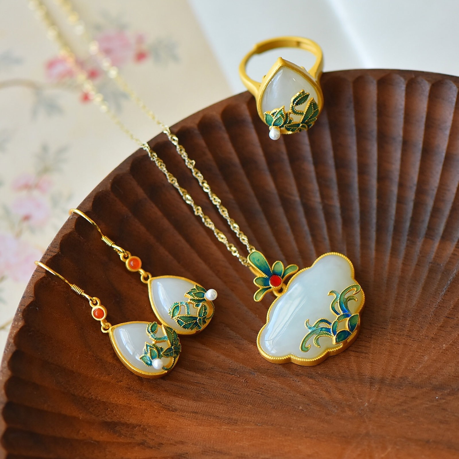 A Set of Fine Sterling Silver-Gold Plated Inlaid White Jade Jewelrys: A Set of Fine Sterling Silver-Gold Plated Inlaid White Jade Jewelrys,Size:(Pendant)18mmx26mm,(Ring)2mmx16mm,(Earrings)12mmx16mm 一套纯银镀金镶白玉