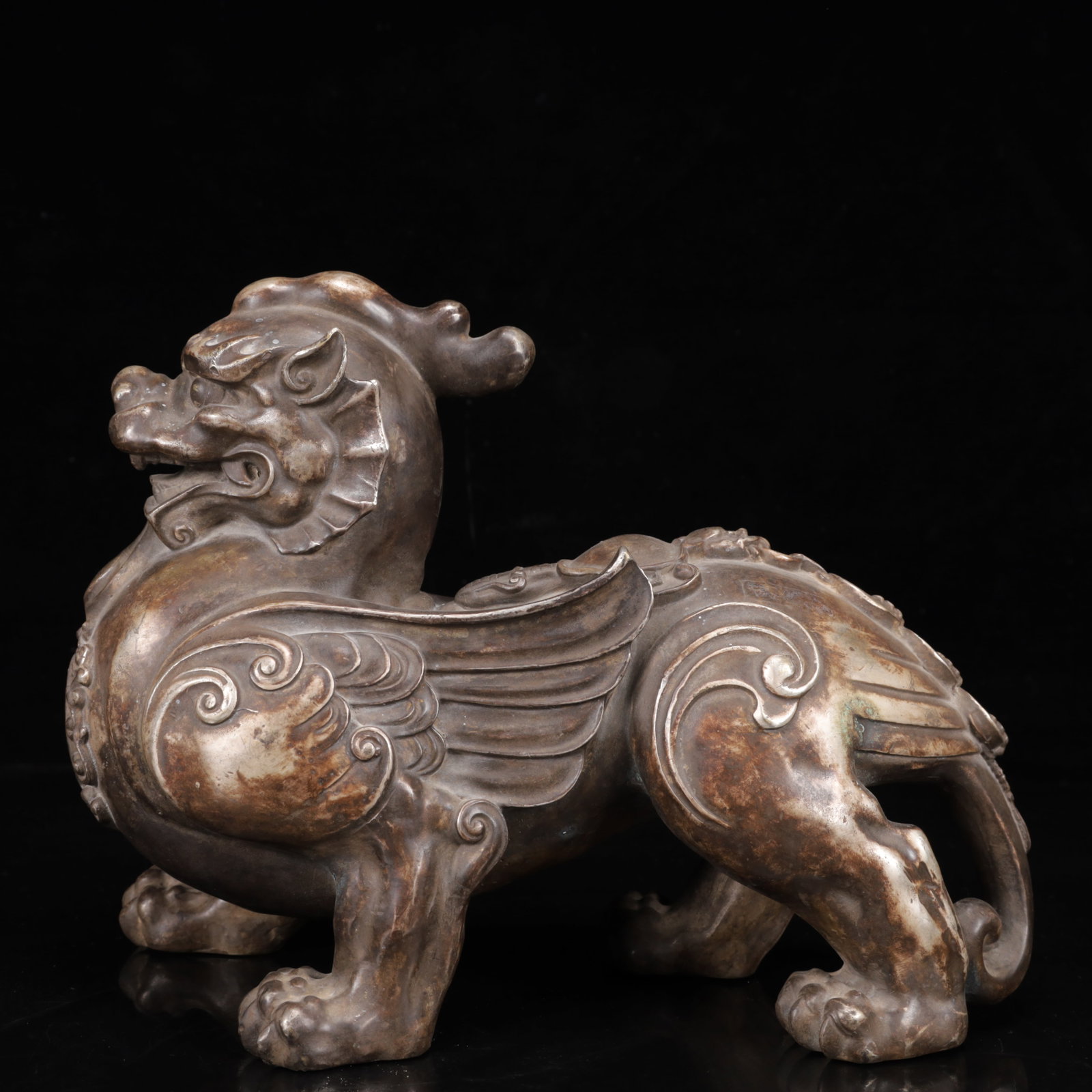An Exquisite Silver-Plated Bronze Lion Ornament: An Exquisite Silver-Plated Bronze Lion Ornament,Qing Dynasty,China,Size:10.6inx3.9inx8.3in,Weight:5150g 铜镀银狮子摆件,中国清代