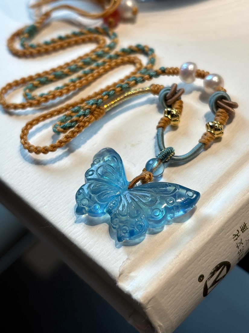 An Exquisite Aquamarine Butterfly Pendant: An Exquisite Aquamarine Butterfly Pendant,Size:34mmx20mm,Total Weight:7.6g 海蓝宝蝴蝶吊坠