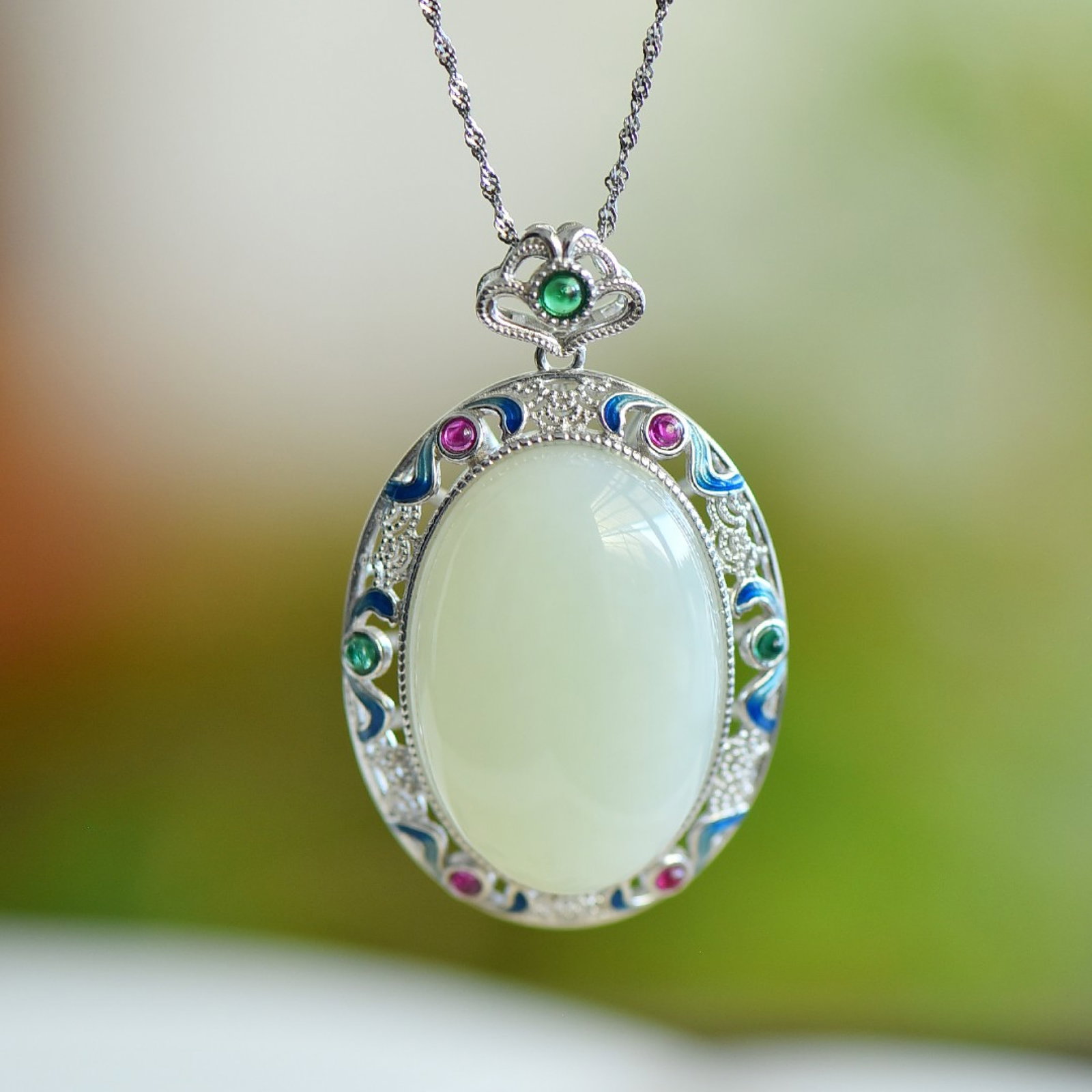 An Exquisite Sterling Silver Inlaid White Jade Enamel Pendant,Inlaid Gems: An Exquisite Sterling Silver Inlaid White Jade Enamel Pendant,Inlaid Gems,Size:20mmx30mm 纯银镶白玉珐琅吊坠，嵌宝石