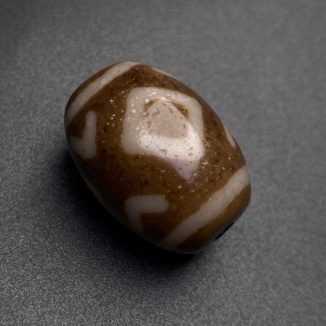 An Exquisite Three Eyes Dzi Bead Pendant: An Exquisite Three Eyes Dzi Bead Pendant,Size:24.5mmx18mm,Weight:11g 三眼天珠挂件