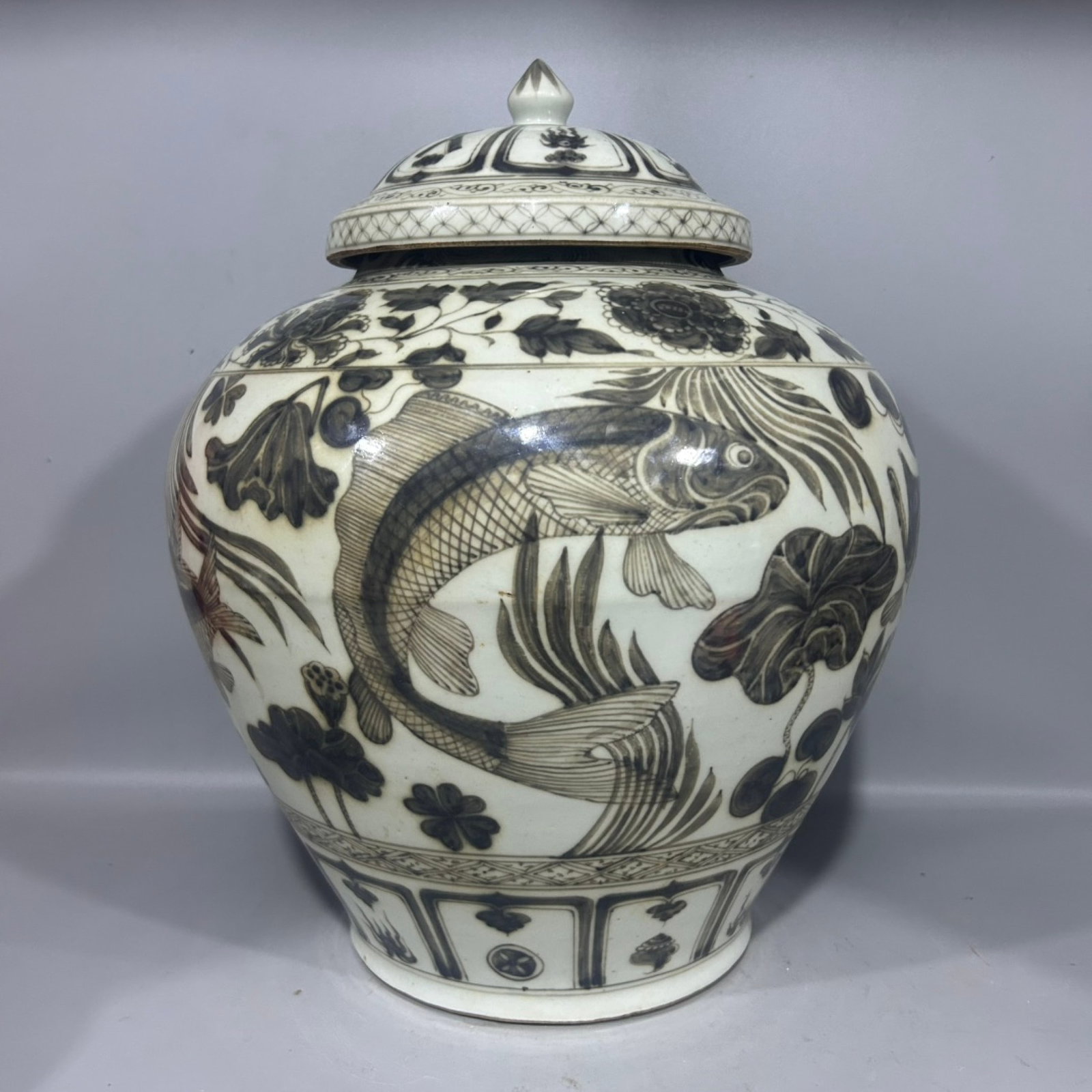 A Rare Underglaze-Red Hornwort Pattern Cover Jar: A Rare Underglaze-Red Hornwort Pattern Cover Jar,Qing Dynasty,China,Size:9.6inx14.6in 釉里红鱼藻纹盖罐,中国清代