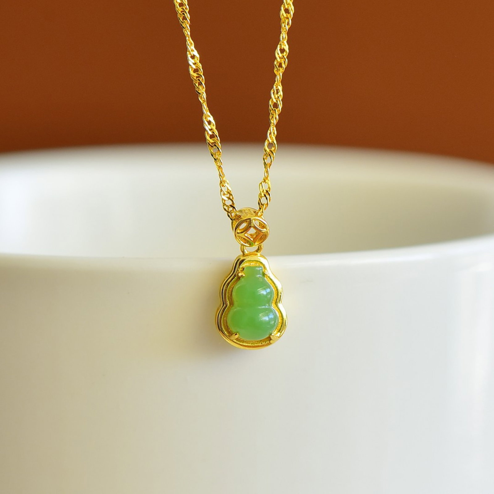 An Exquisite Sterling Silver-Gold Plated Inlaid Jasper Gourd Pendant: An Exquisite Sterling Silver-Gold Plated Inlaid Jasper Gourd Pendant,Size:5mmx7mm 纯银镀金镶碧玉葫芦吊坠