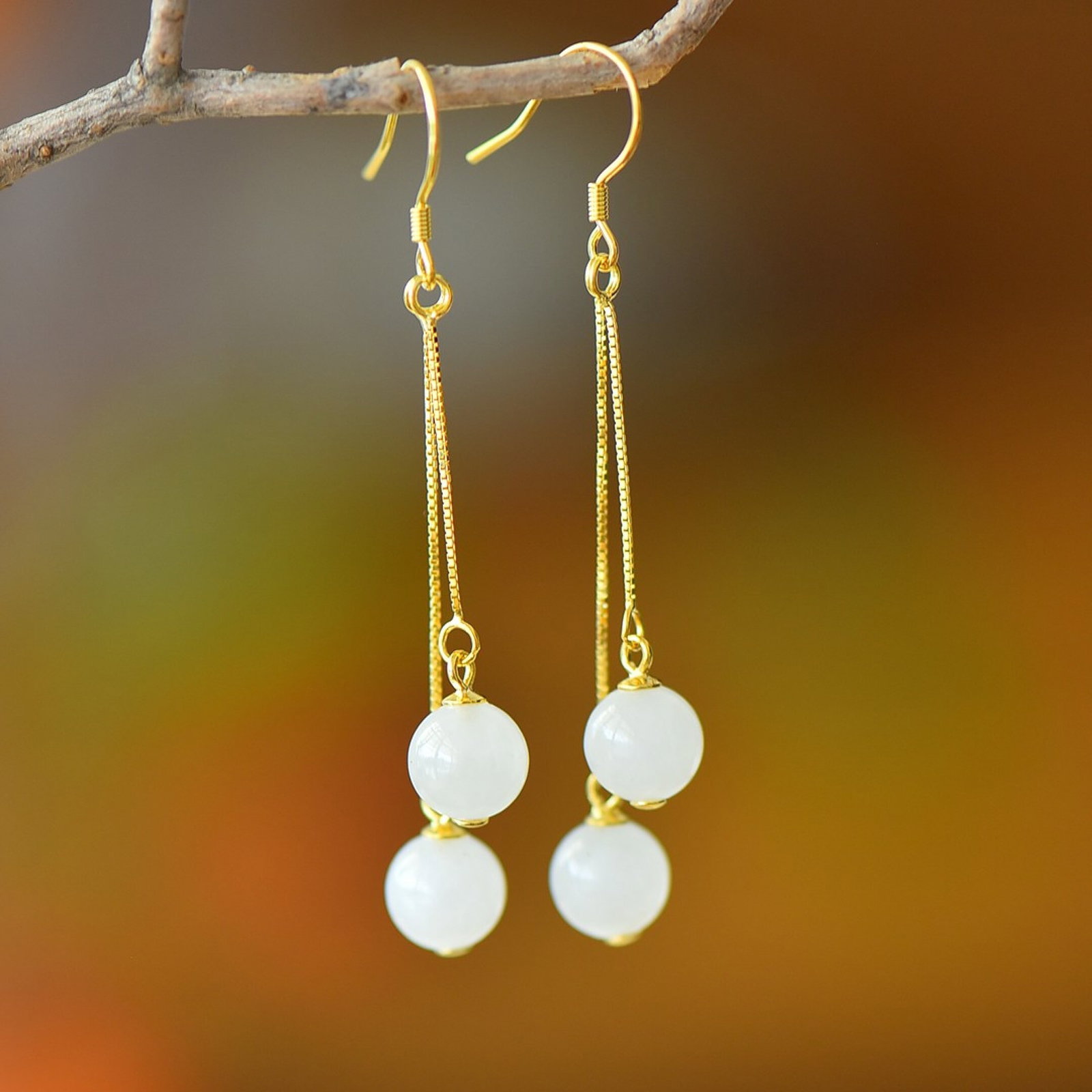 A Pair of Exquisite Sterling Silver-Gold Plated Inlaid White Jade Earrings: A Pair of Exquisite Sterling Silver-Gold Plated Inlaid White Jade Earrings,Size:8mm 一对纯银镀金镶白玉耳环