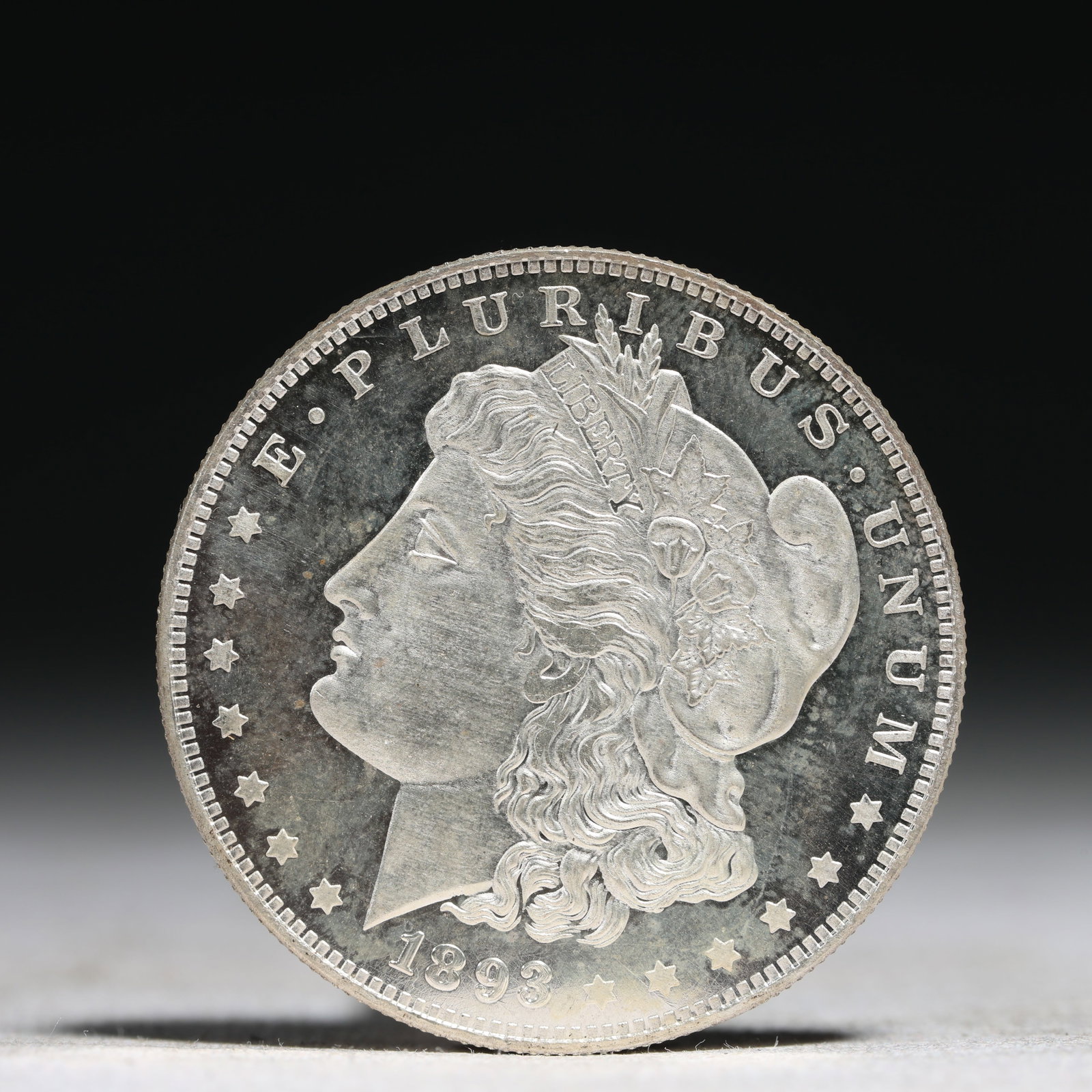 USA Morgan Dollar 1893 Coin: Obv: profile bust with date below and E PLURIBUS UNUM legend and stars around. Rev: eagle with In God we trust above within wreath with UNITED STATES OF AMERICA ONE DOLLAR legend. IN GOD WE TRUST /