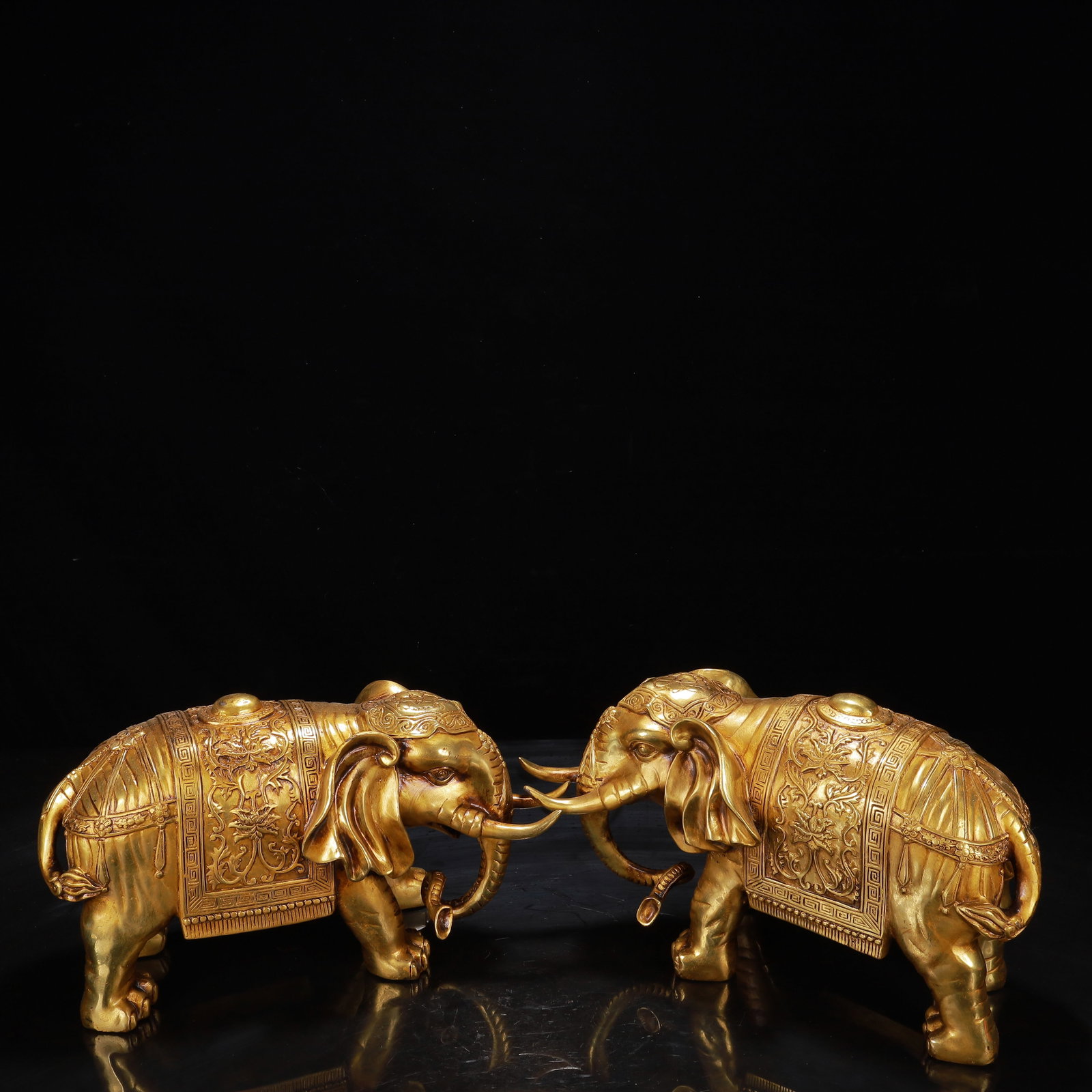 A Pair of Exquisite Gilt Bronze Lotus Pattern Elephant Ornaments: A Pair of Exquisite Gilt Bronze Lotus Pattern Elephant Ornaments,Qing Dynasty,China,Size:12.2inx5.5inx7.1in*2,Weight:8800g 一对铜鎏金缠枝莲纹ŧ