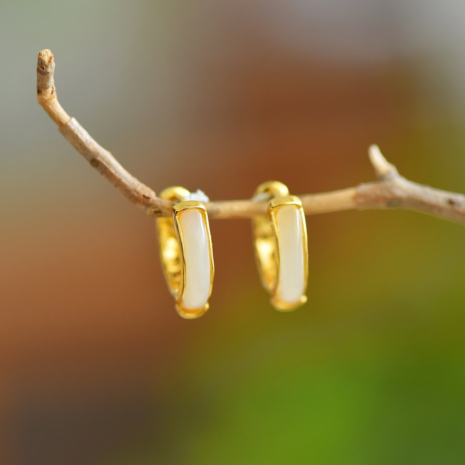 A Pair of Exquisite Sterling Silver-Gold Plated Inlaid White Jade Earrings: A Pair of Exquisite Sterling Silver-Gold Plated Inlaid White Jade Earrings 一对纯银镀金镶白玉耳环