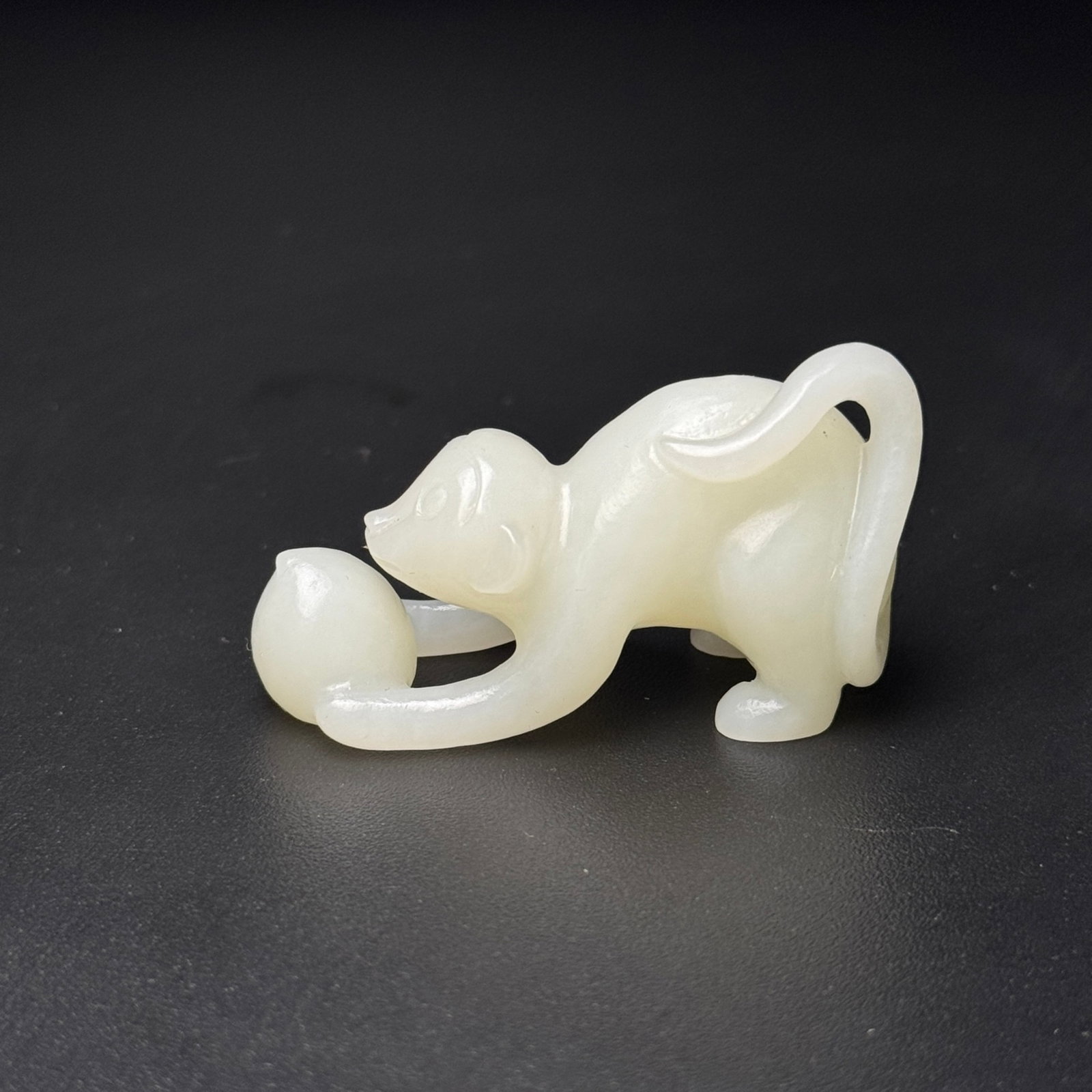 An Exquisite White Jade Monkey Pendant: An Exquisite White Jade Monkey Pendant,Qing Dynasty,China,Size:54mmx30mmx20mm,Weight:34g 白玉猴挂件,中国清代