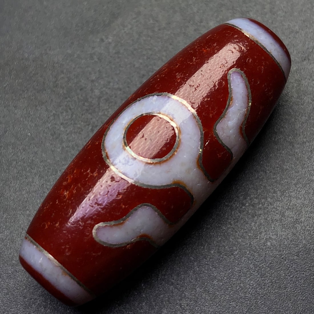 An Exquisite Dzi Bead Pendant: An Exquisite Dzi Bead Pendant,Size:40mmx15mm,Weight:14.2g 天珠挂件