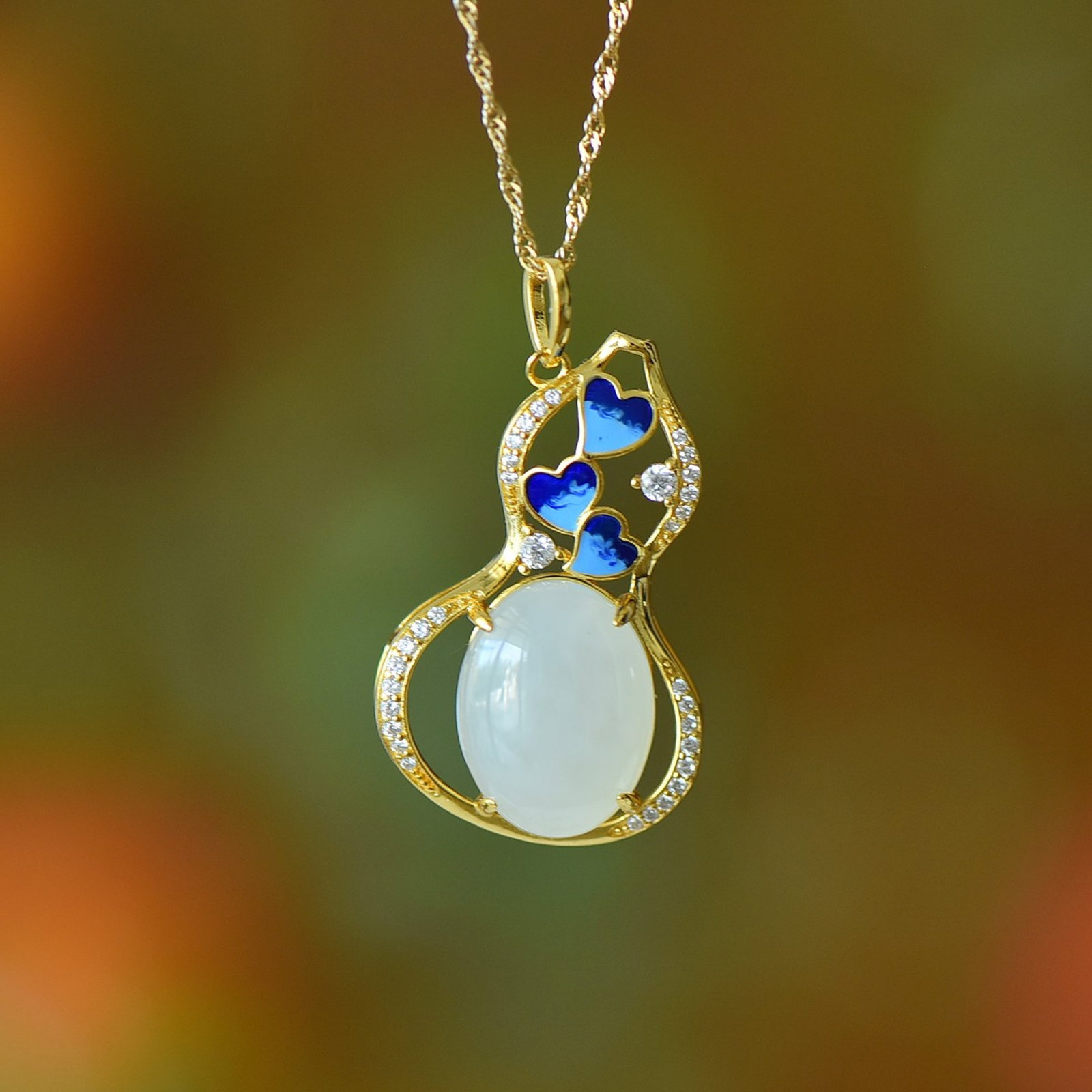 An Exquisite Sterling Silver-Gold Plated Inlaid White Jade Gourd Pendant: An Exquisite Sterling Silver-Gold Plated Inlaid White Jade Gourd Pendant,Size:12mmx16mm 纯银镀金镶白玉葫芦吊坠