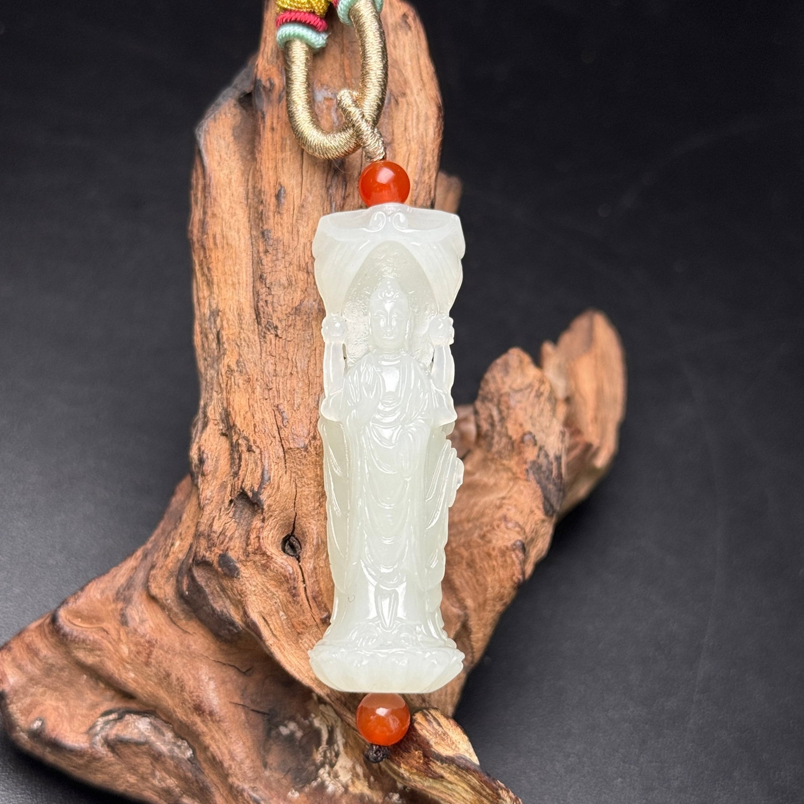 An Exquisite White Jade Buddha Statue Pattern Pendant: An Exquisite White Jade Buddha Statue Pattern Pendant,Qing Dynasty,China,Size:18.5mmx58mm,Weight:28g 白玉佛像纹挂件,中国清代