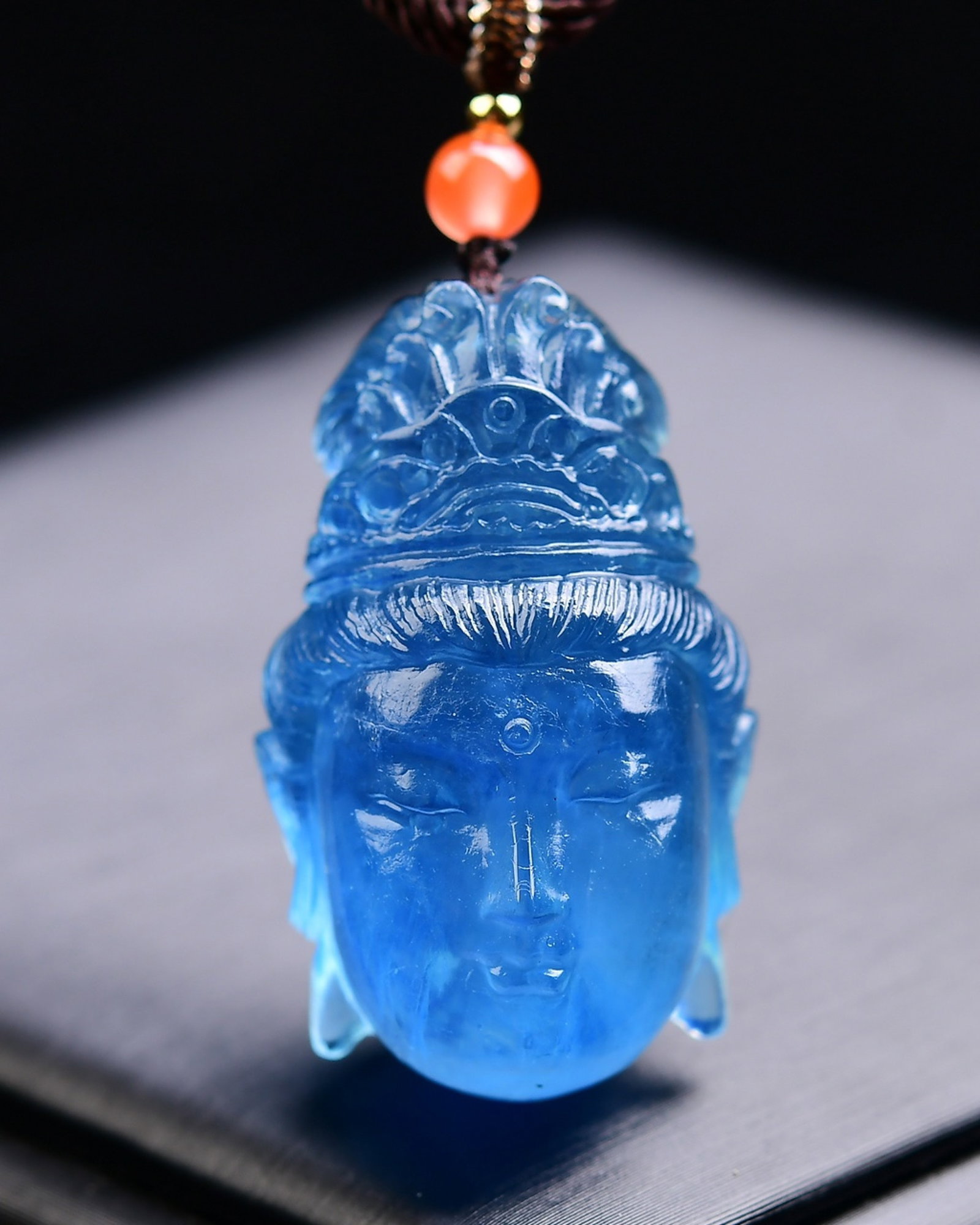 An Exquisite Aquamarine Buddha-head Pendant: An Exquisite Aquamarine Buddha-head Pendant,Size:40mmx33mmx20mm,Weight:22g 海蓝宝佛头吊坠 寓意:能使人遇呈难