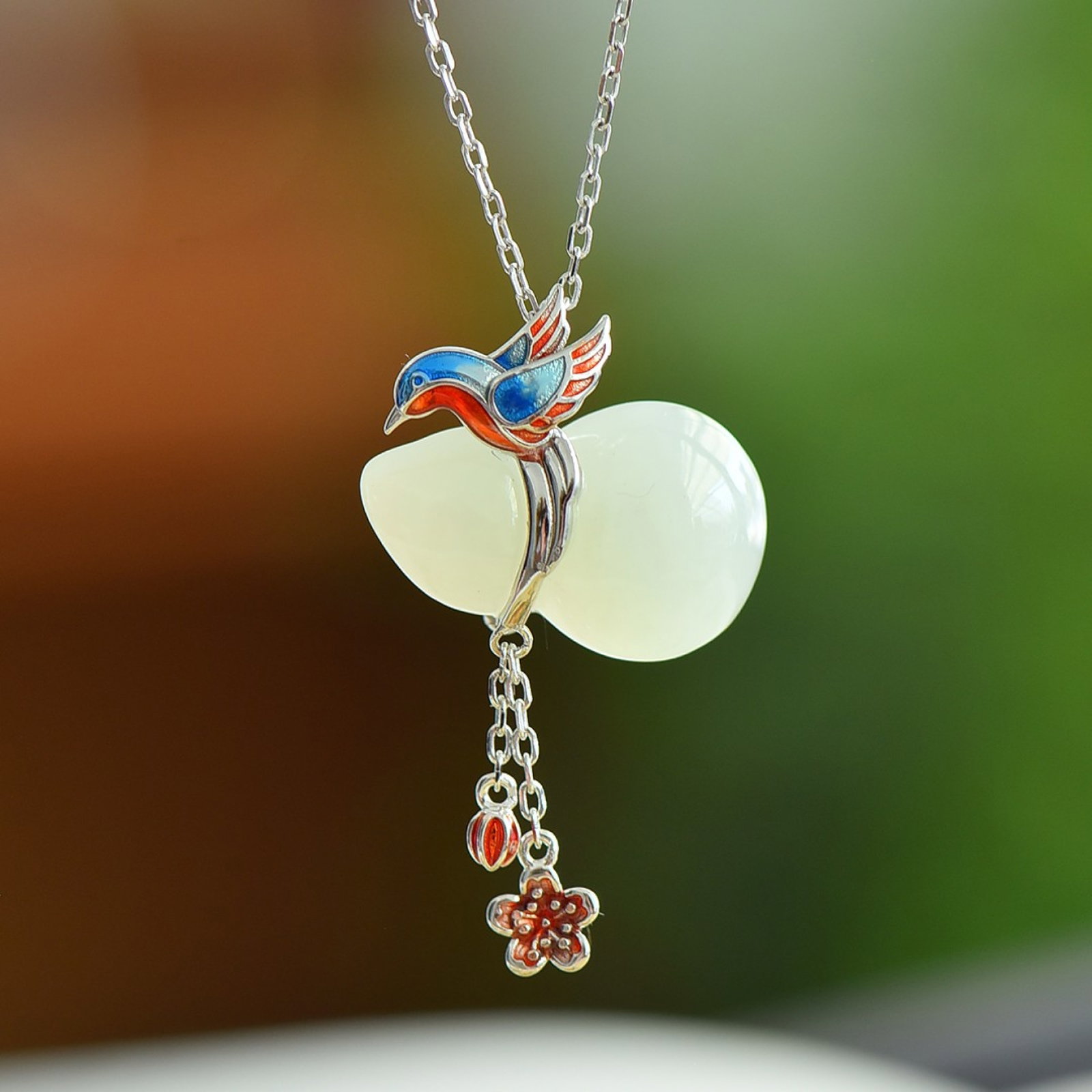 An Exquisite Sterling Silver Inlaid White Jade Gourd Pendant: An Exquisite Sterling Silver Inlaid White Jade Gourd Pendant,Size:22mmx14mm 纯银镶白玉葫芦吊坠