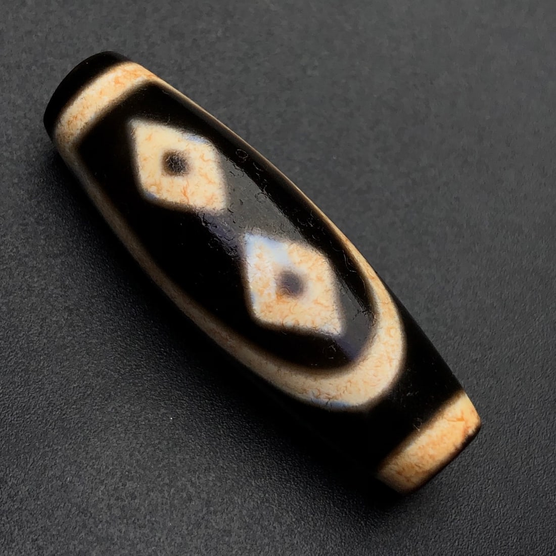 An Exquisite Two Eyes Dzi Bead Pendant: An Exquisite Two Eyes Dzi Bead Pendant,Size:37mmx12mm,Weight:8.2g 两眼天珠挂件