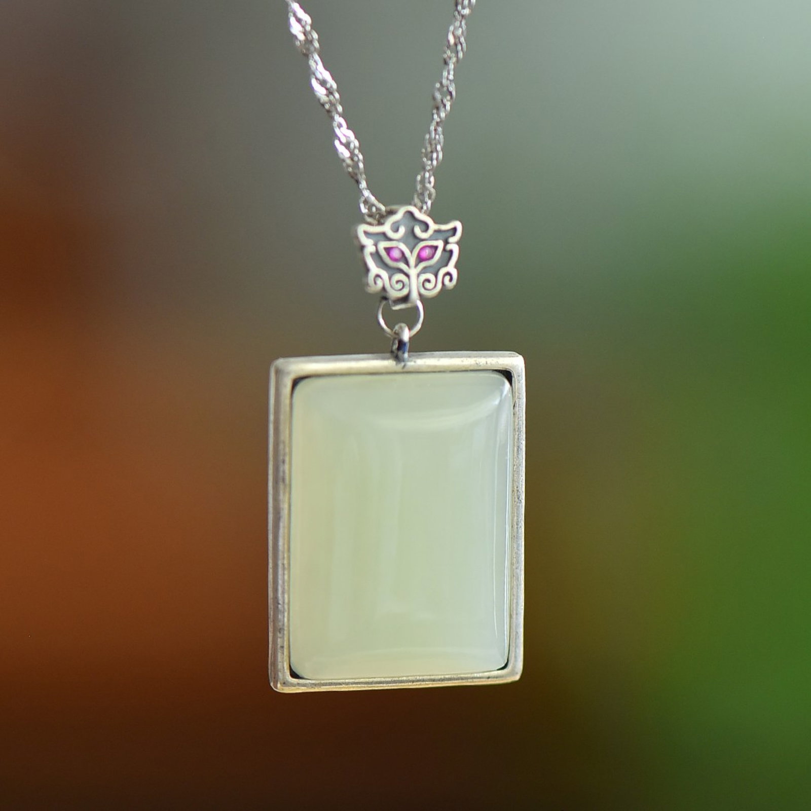 An Exquisite Sterling Silver Inlaid White Jade Pendant: An Exquisite Sterling Silver Inlaid White Jade Pendant,Size:15mmx20mm 纯银镶白玉吊坠
