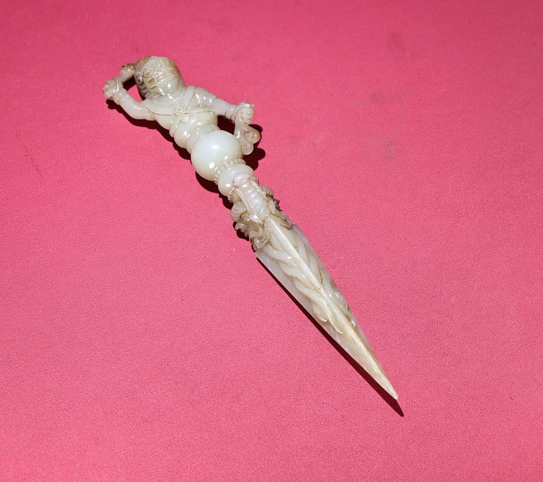 An Exquisite White Jade Figure-Shaped Vajry Pestle: An Exquisite White Jade Figure-Shaped Vajry Pestle,Qing Dynasty,China,Size:236mmx70mmx26mm,Weight:197g 白玉人物形金刚杵,中国清代