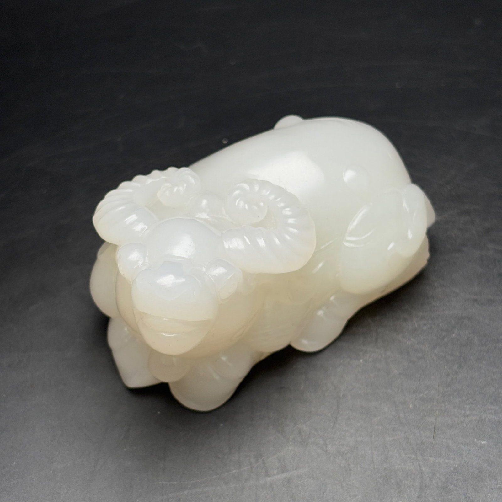 An Exquisite White Jade Buffalo Ornament: An Exquisite White Jade Buffalo Ornament,Qing Dynasty,China,Size:93mmx52mmx48mm,Weight:333g 白玉牛摆件,中国清代
