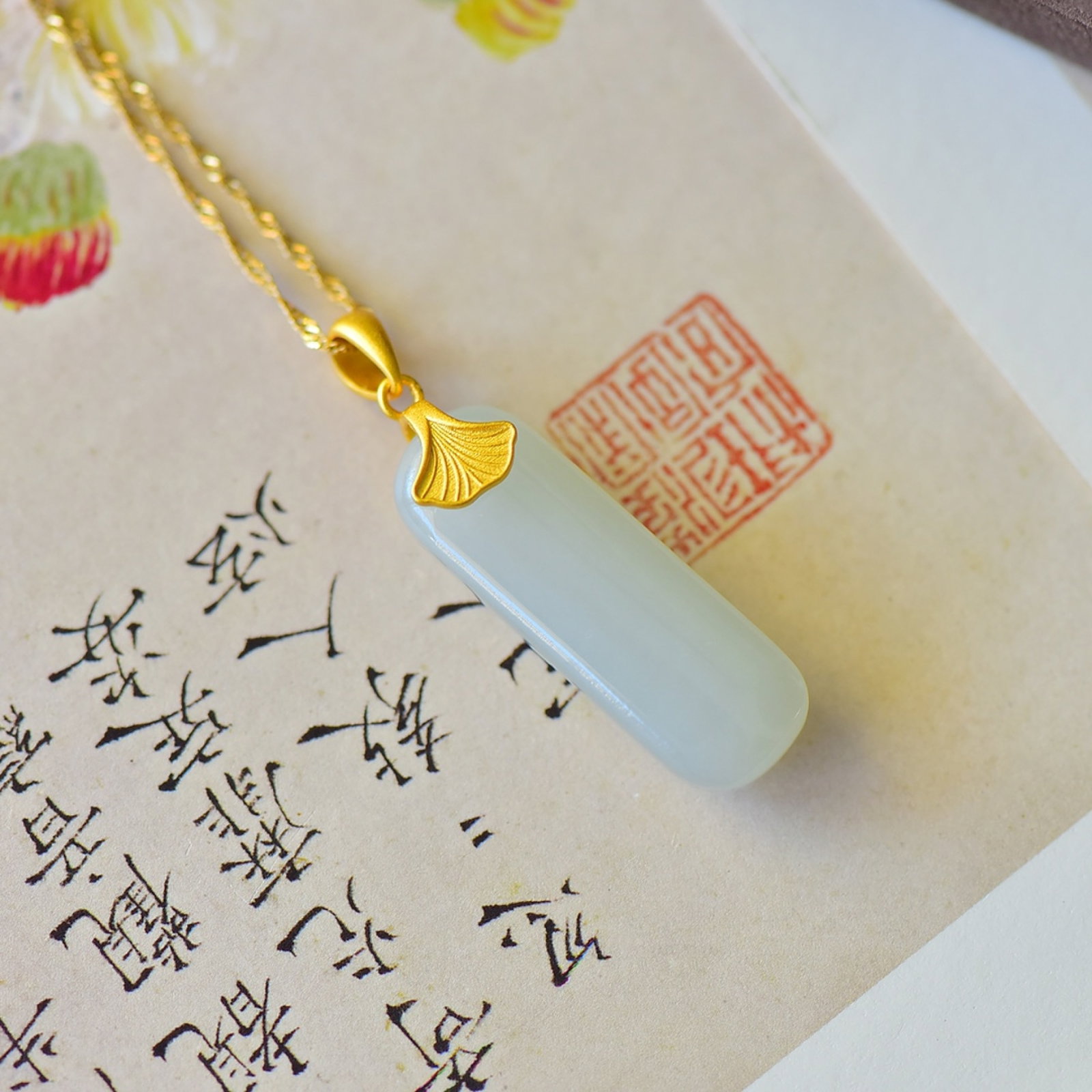 An Exquisite Sterling Silver-Gold Plated Inlaid White Jade Pendant: An Exquisite Sterling Silver-Gold Plated Inlaid White Jade Pendant,Size:10mmx31mm 纯银镀金镶白玉吊坠