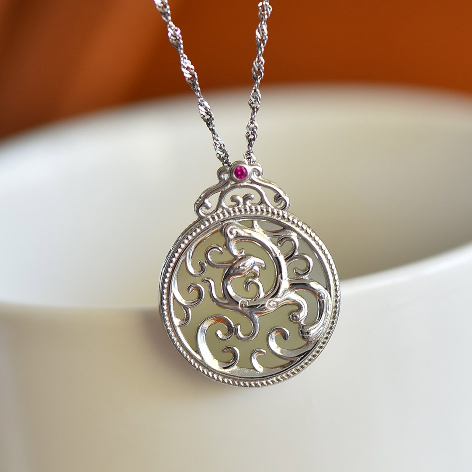 An Exquisite Sterling Silver Inlaid White Jade Pendant: Sterling Silver Inlaid White Jade Pendant , Size :18mmx18mm 纯银镶白玉吊坠,尺寸:18mmx18mm